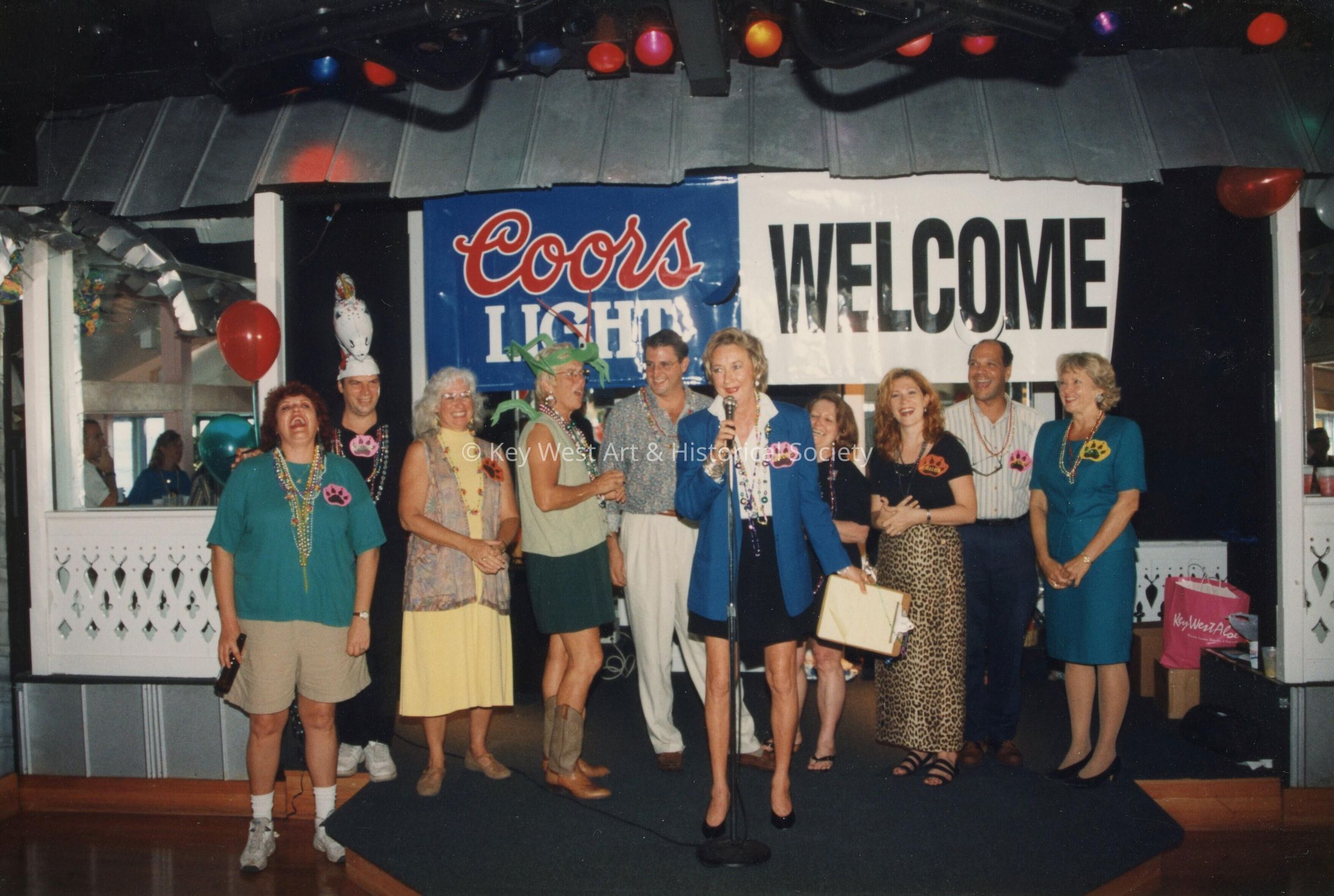 A group of unknown people standing on a stage.