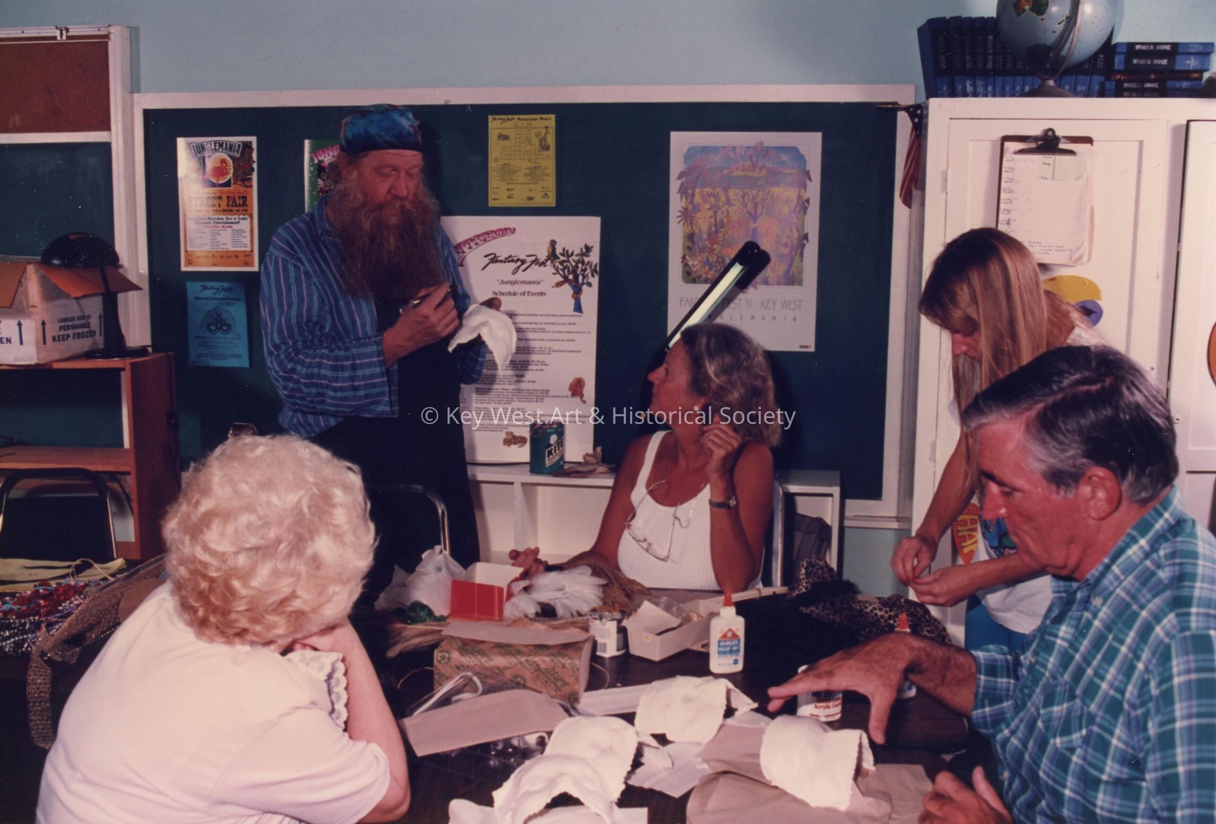 A group of unknown people making face masks.