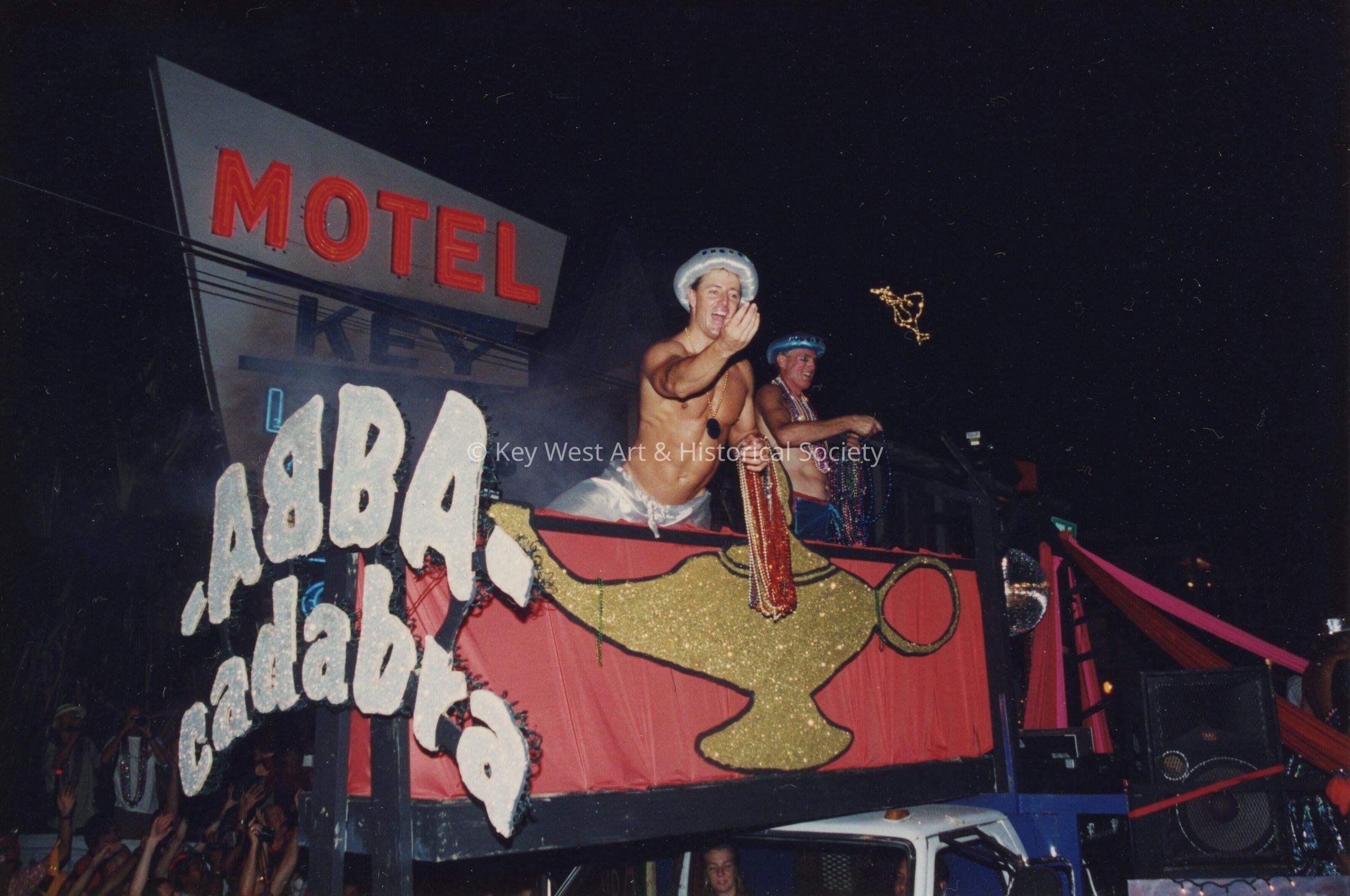 A float in the parade that reads Abba cadabra.