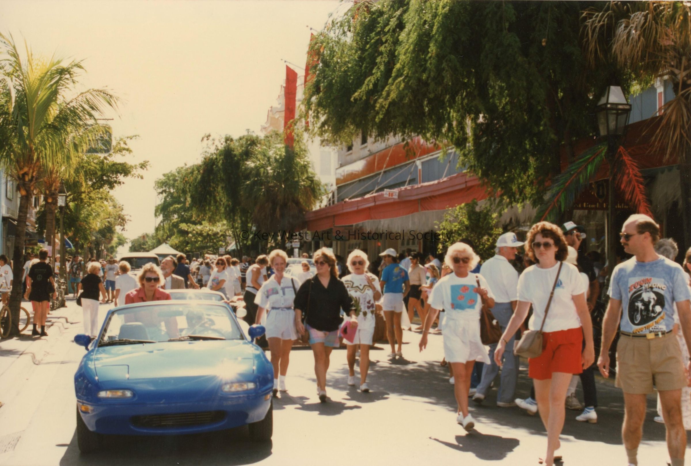 A group unknown people walking on Duval Street.