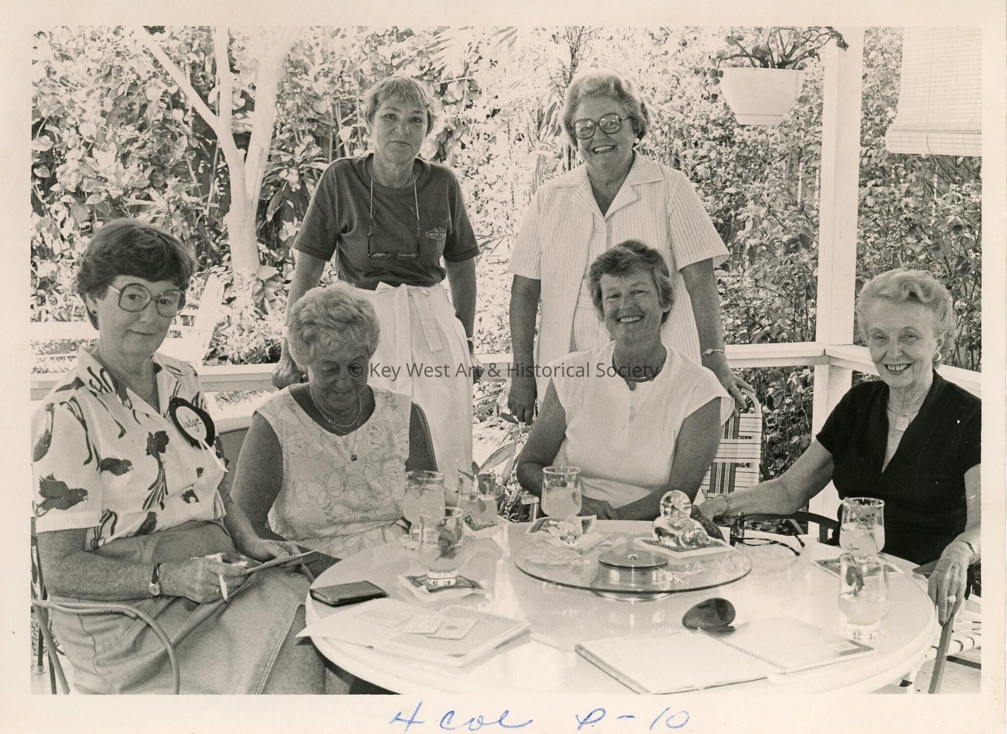 An unknown group of woman around a table