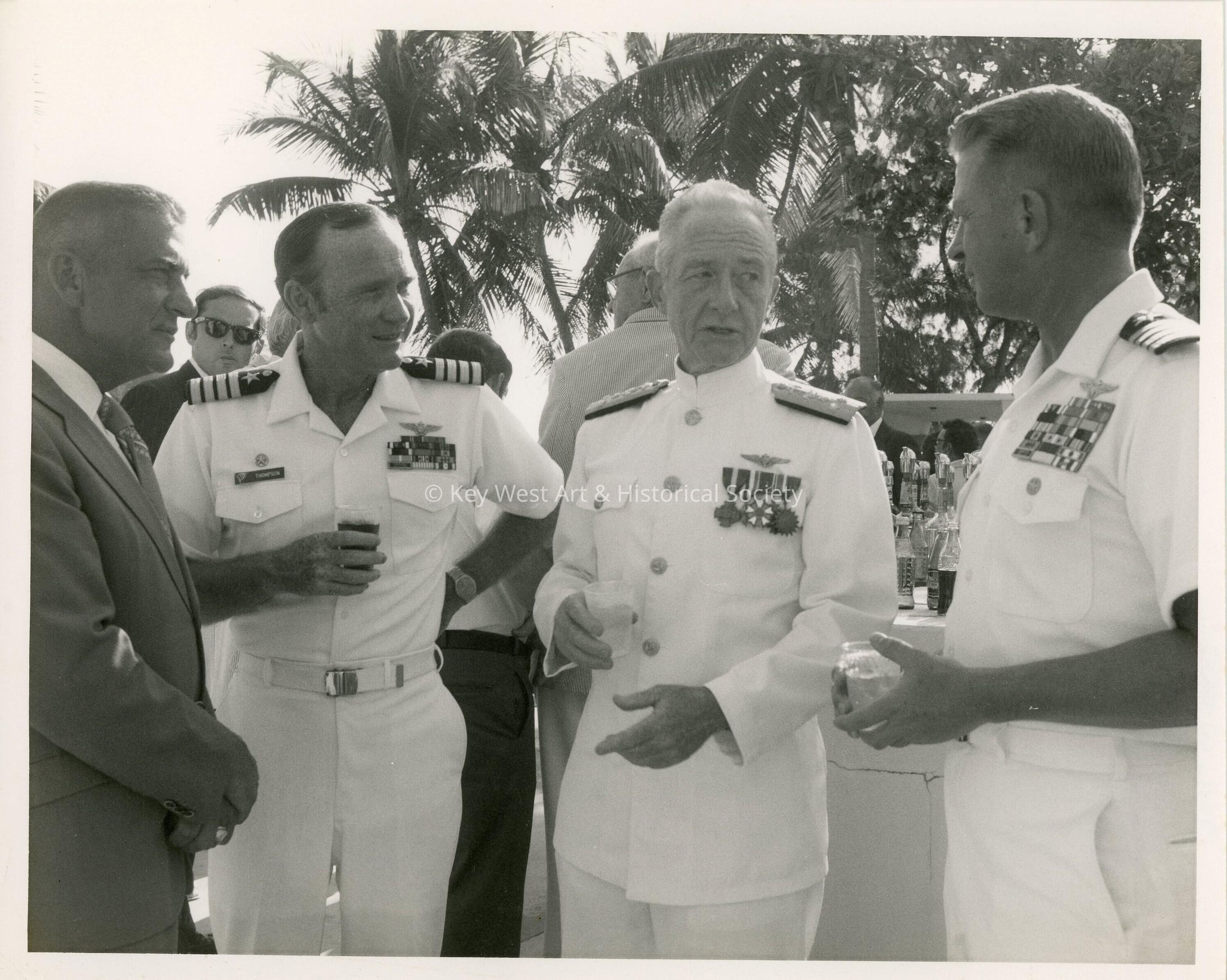 A group of unknown men in uniform talking