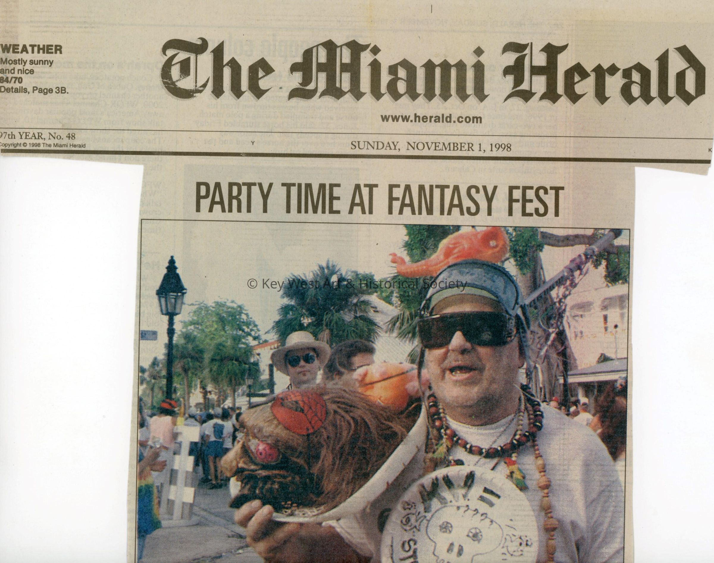 A picture and caption in the Herald about Fantasy Fest.