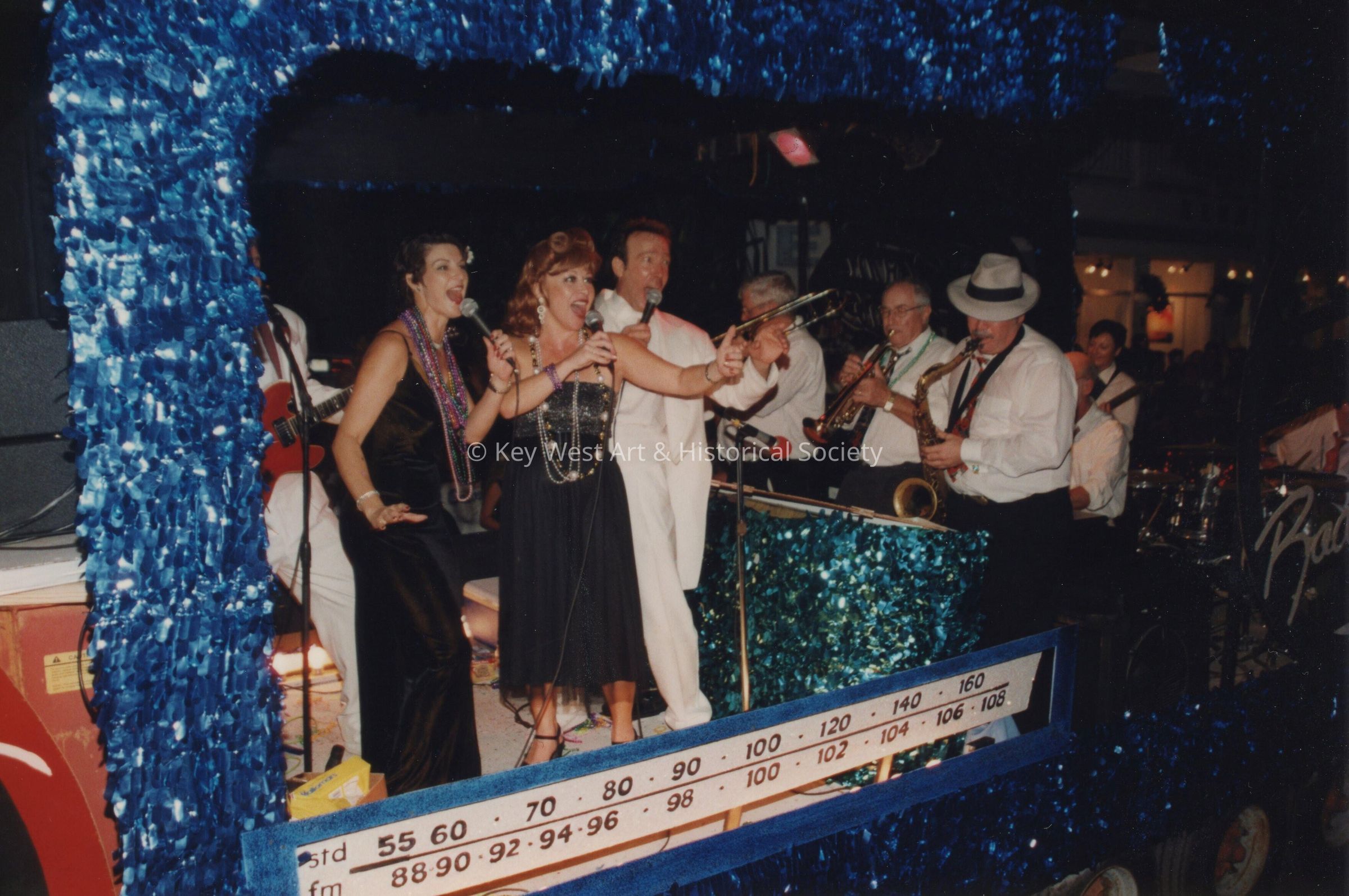A float in the parade that has a band playing.