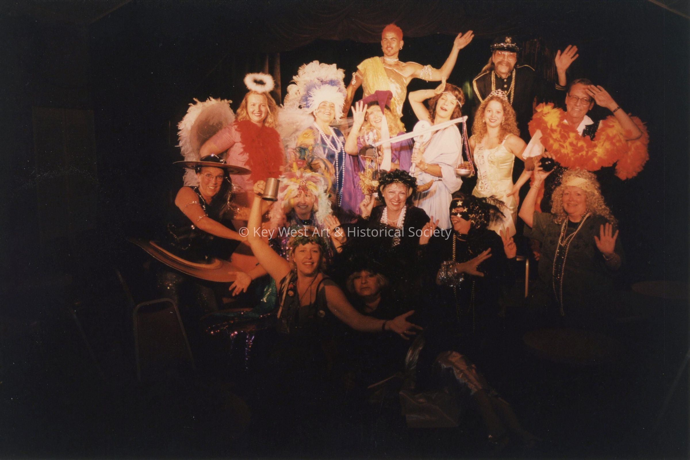 A group of unknown people dressed up.