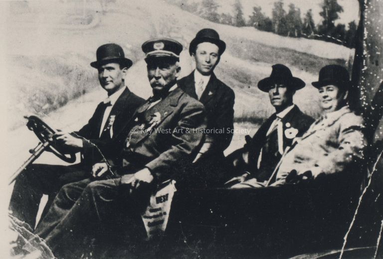 Five men in an open car picture number 1