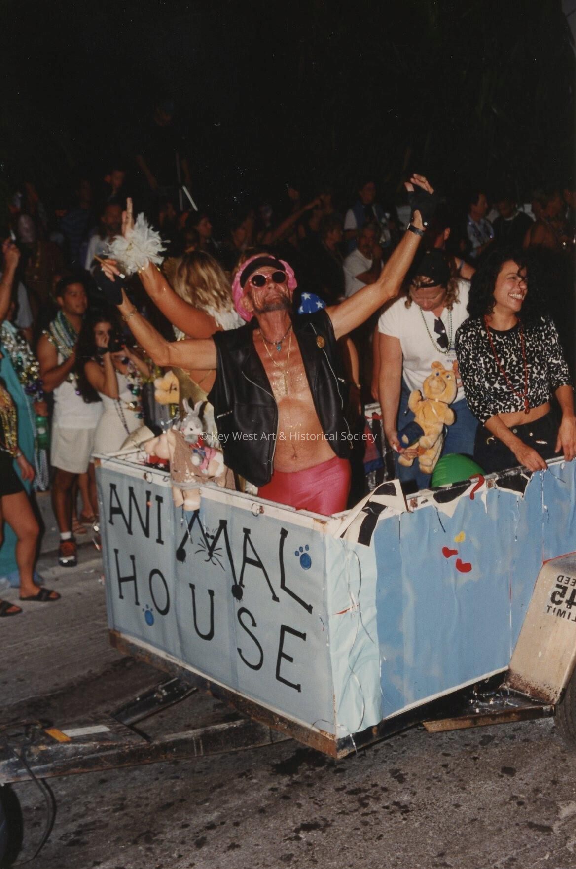 A float in the parade that reads Animal House.
