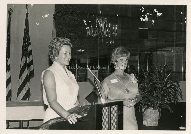 2 Unknown woman at a podium