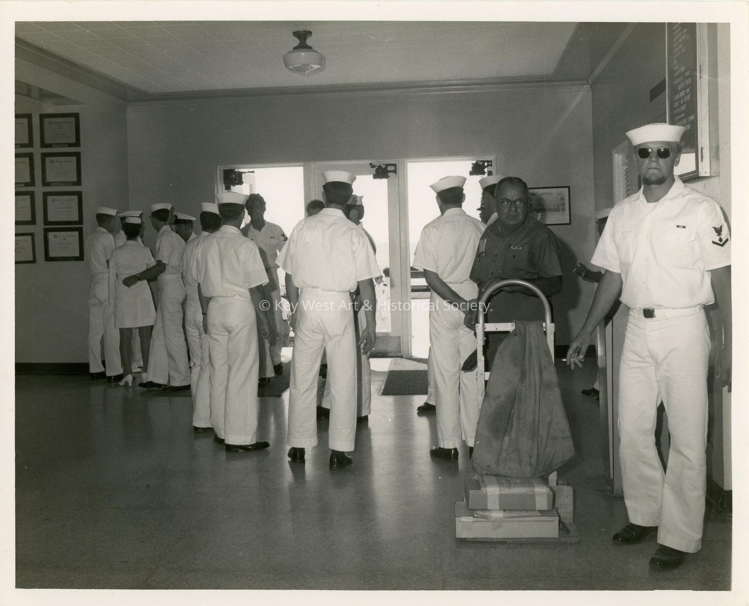 A group of people in uniform inside a building