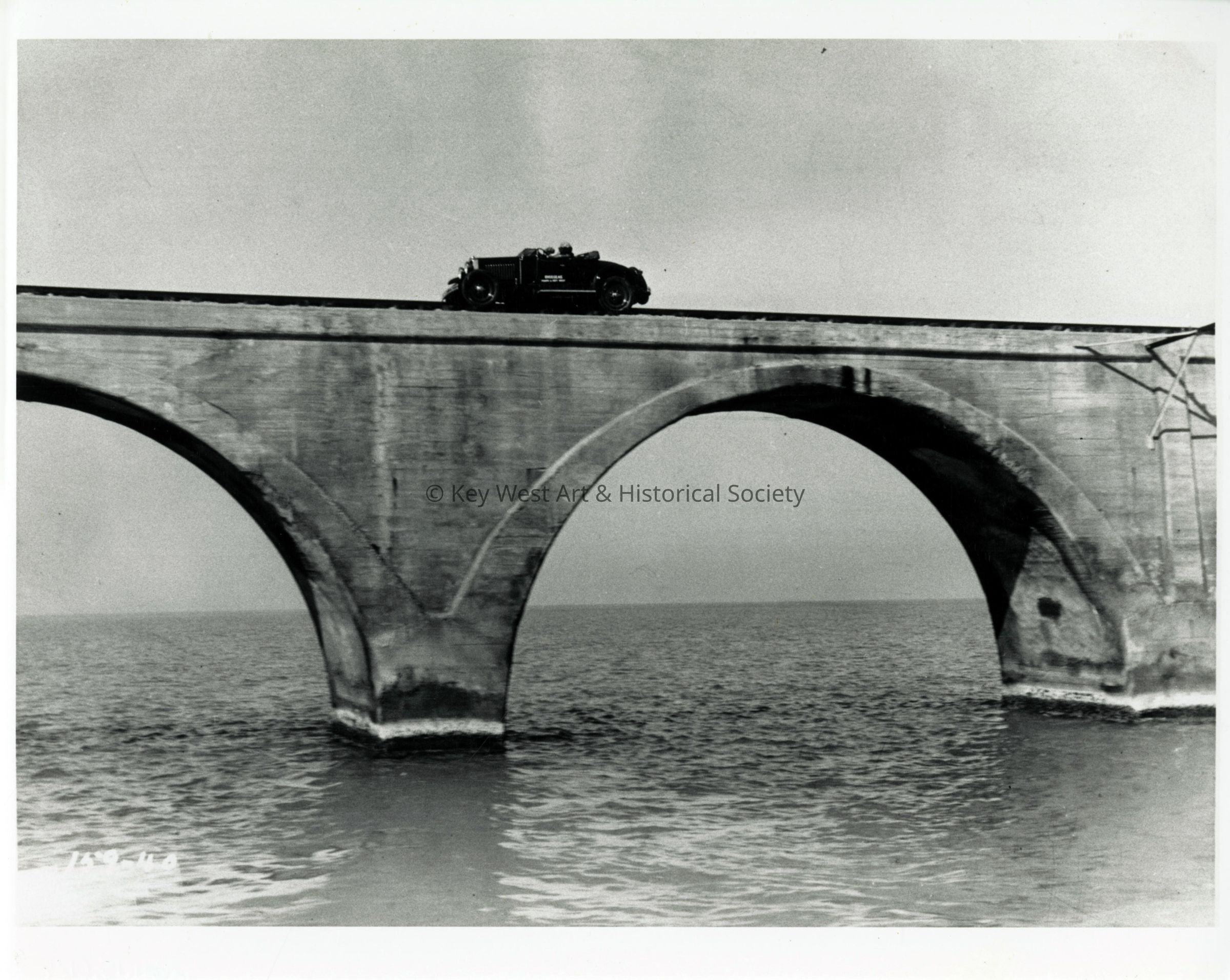 Automobile on Long Key Bridge Railroad Tracks; © Key West Art & Historical Society