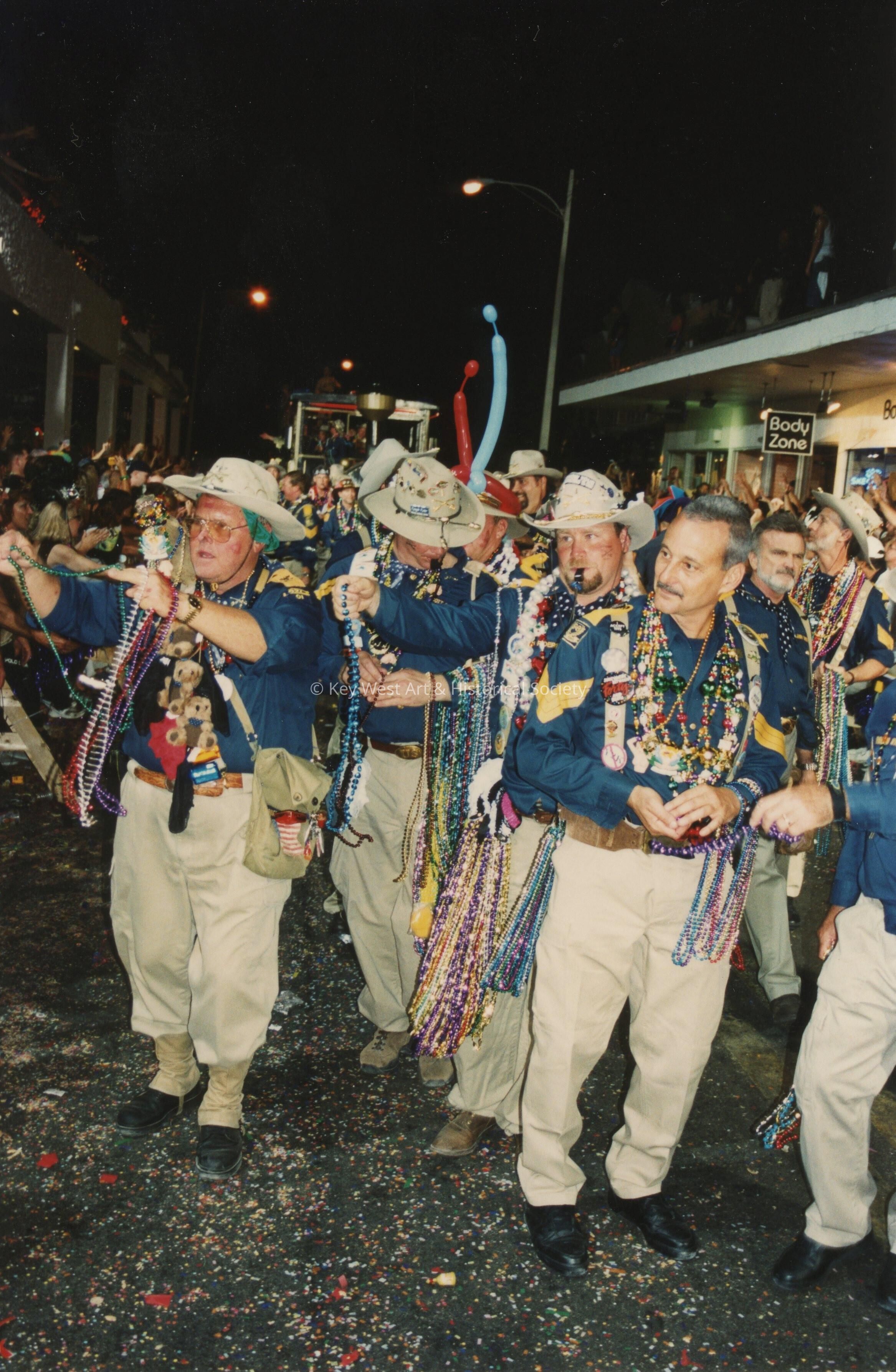 A group of unknown people dressed up.