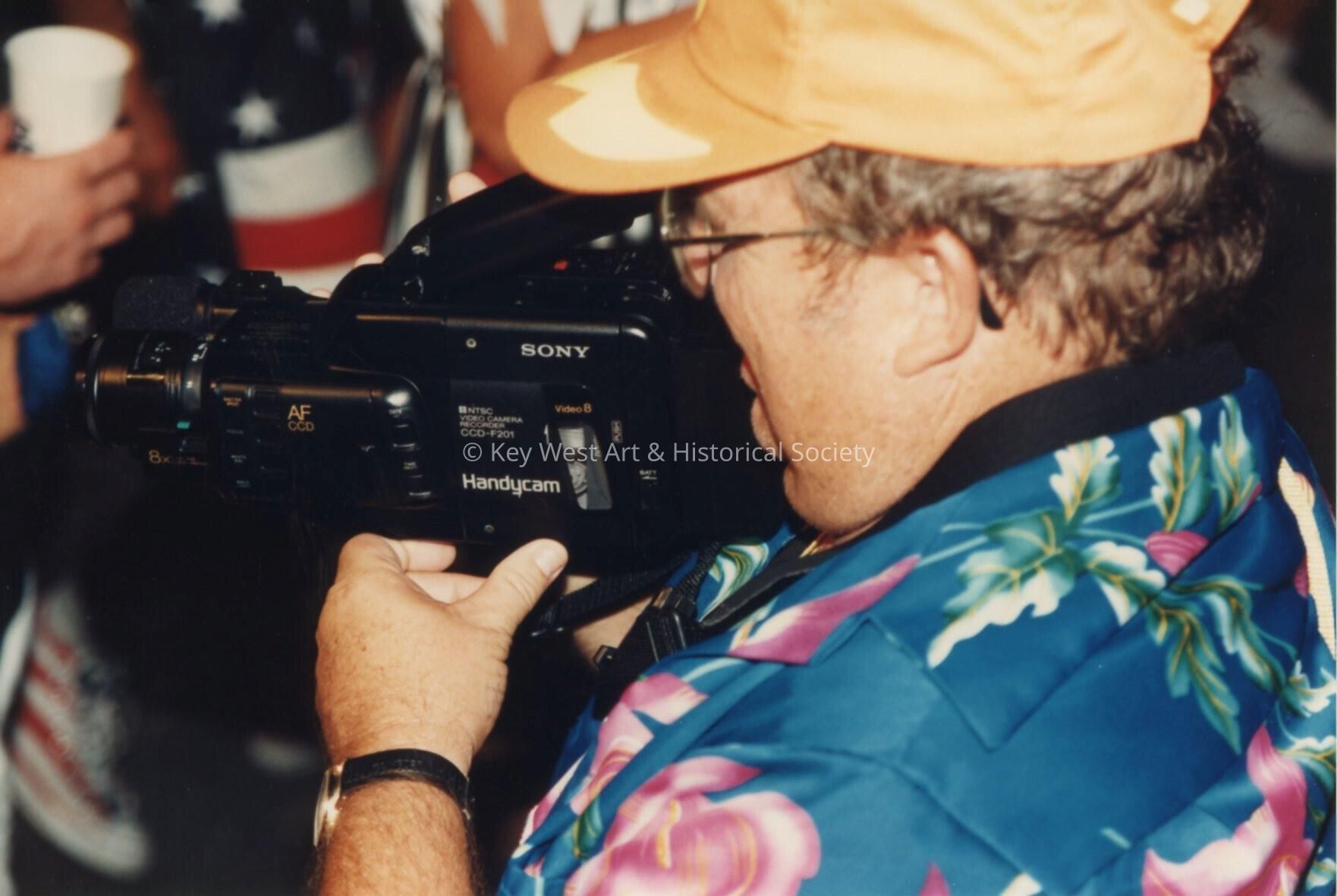 An unknown with a video camera.