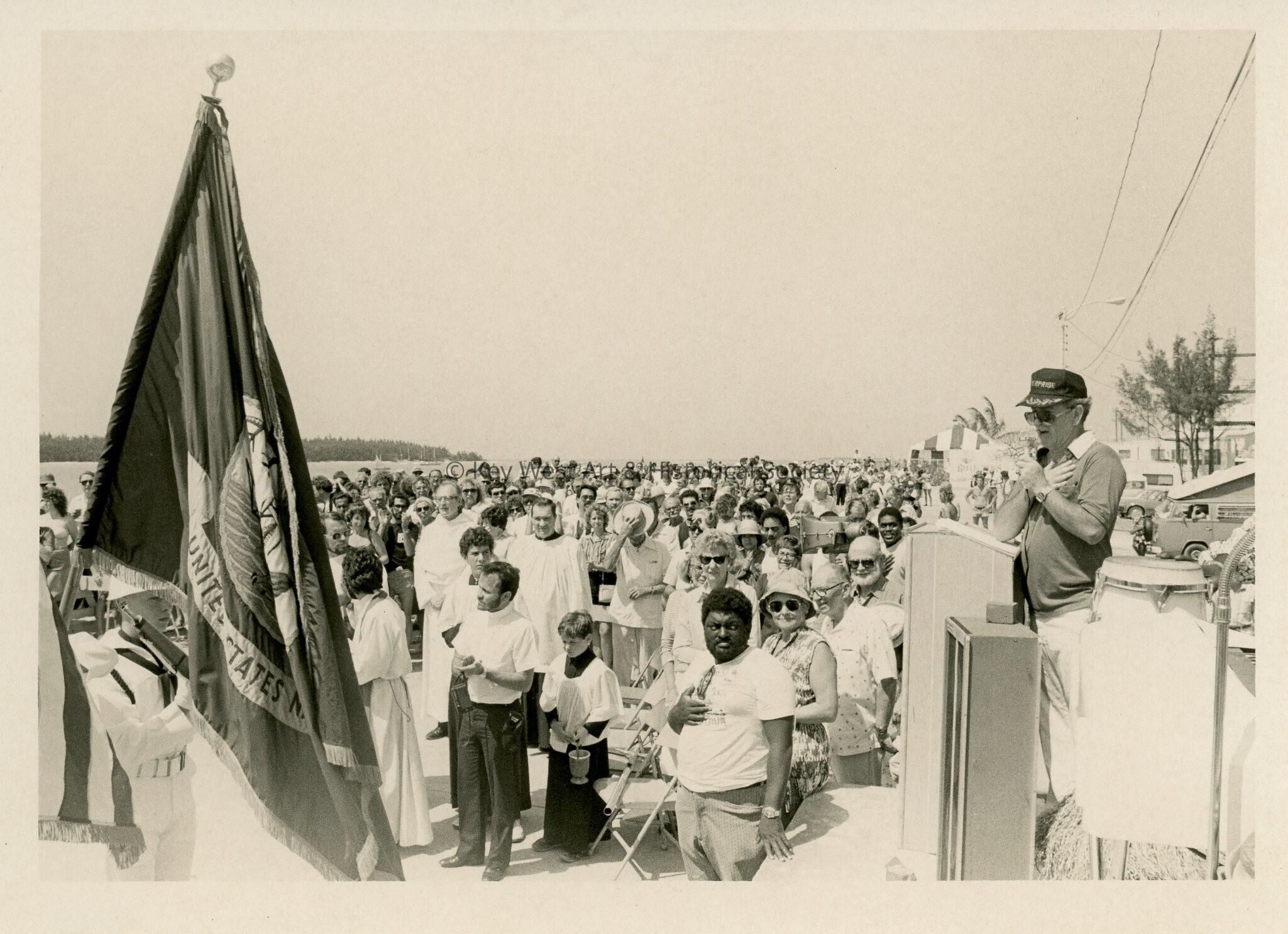 A group of people standing at a ceremony