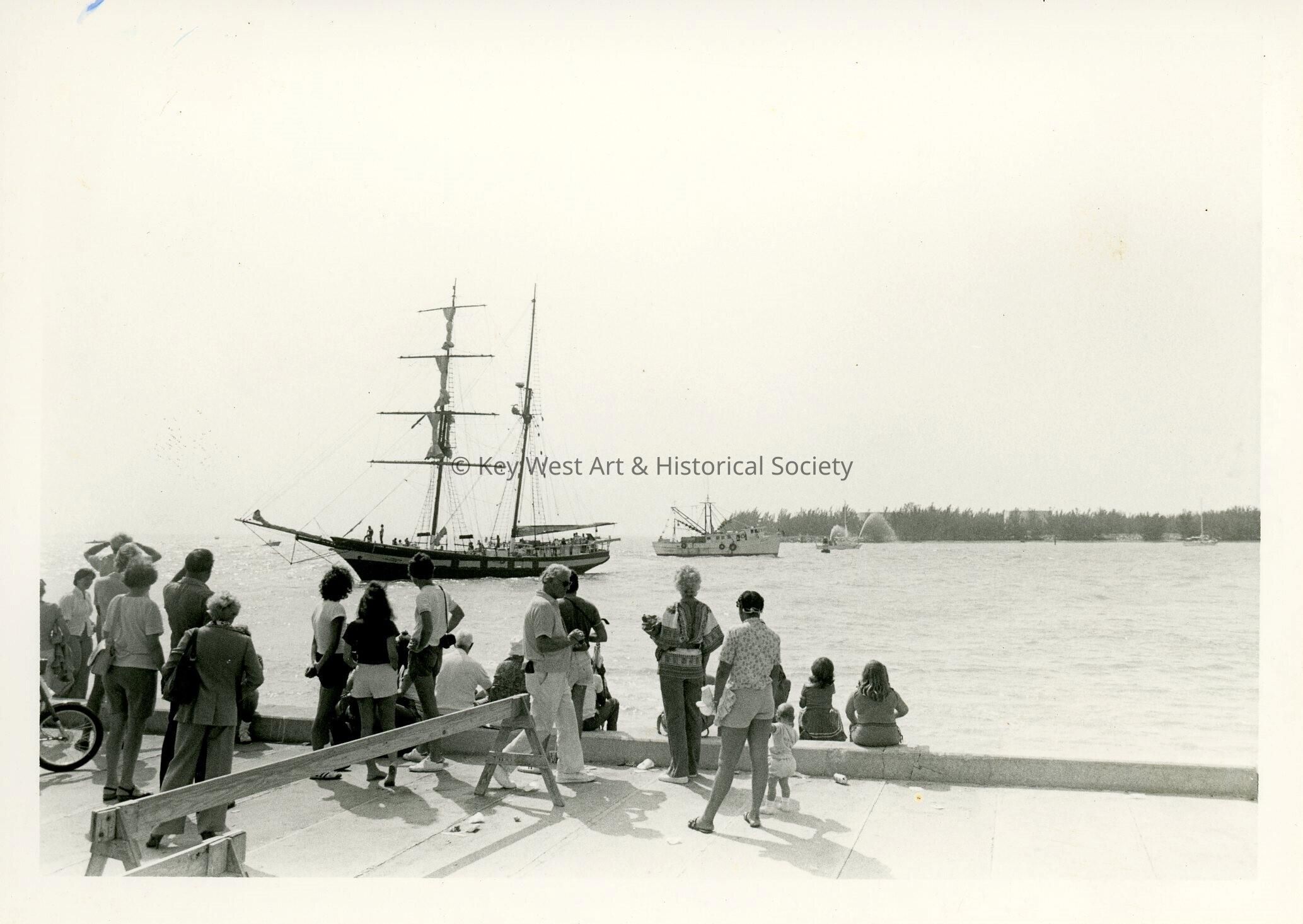 A boat in the ocean with on lookers