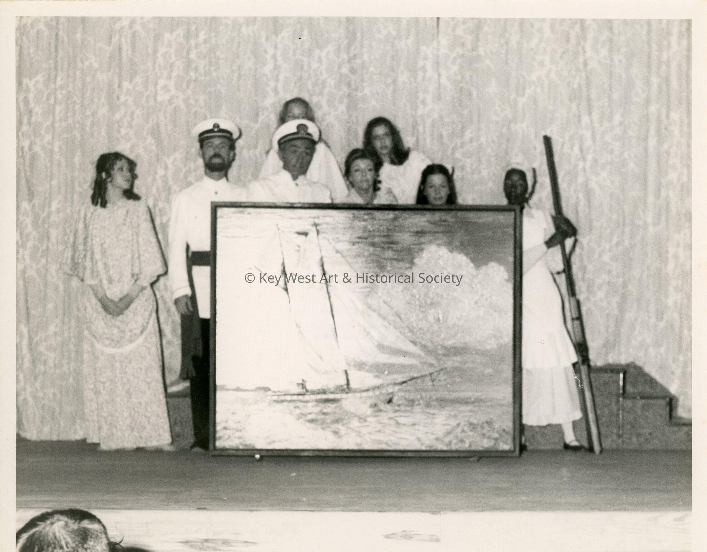 Unknown people with a piece of artwork