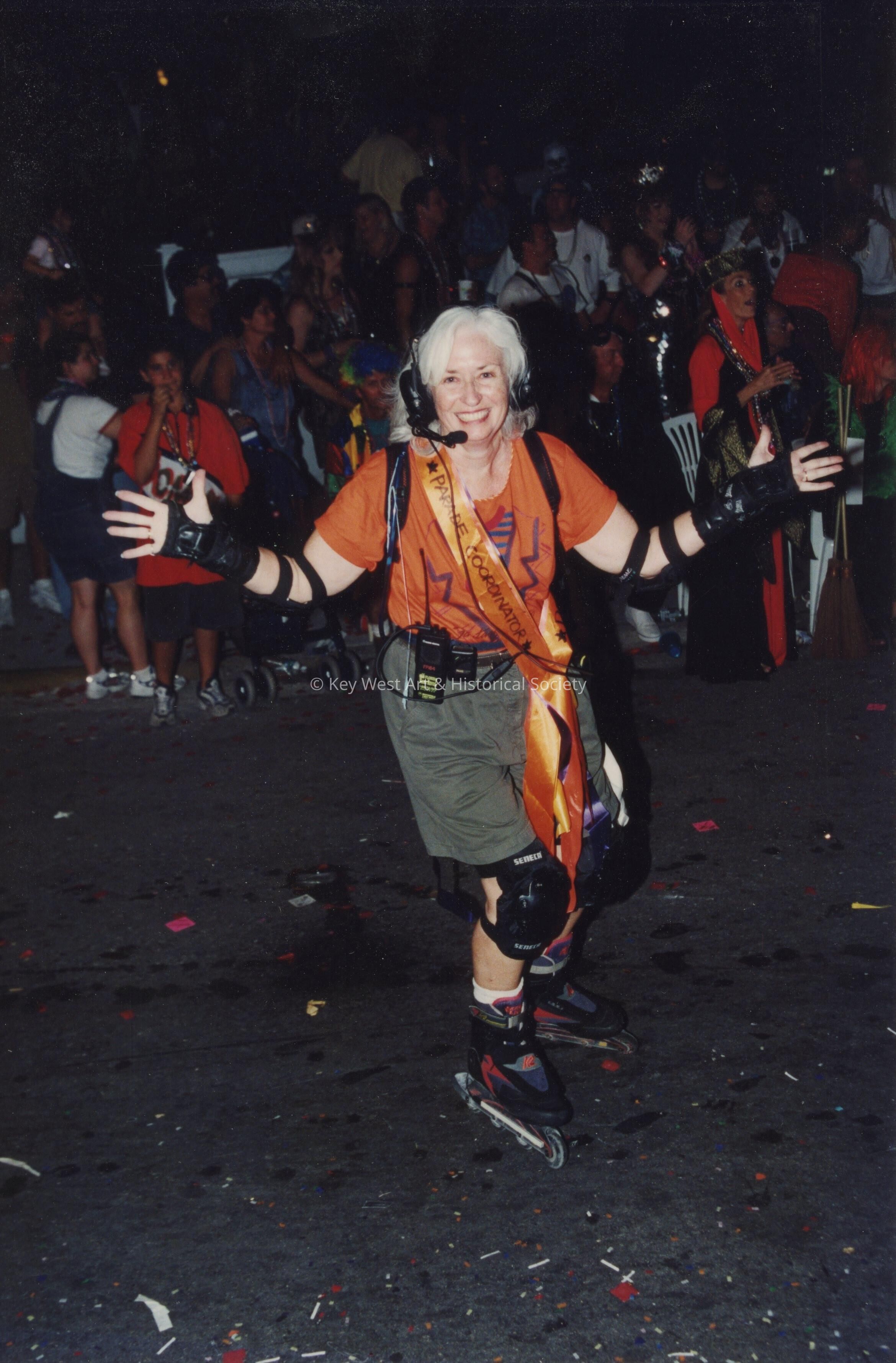 An unknown woman on skates, skating on the street during the parade.