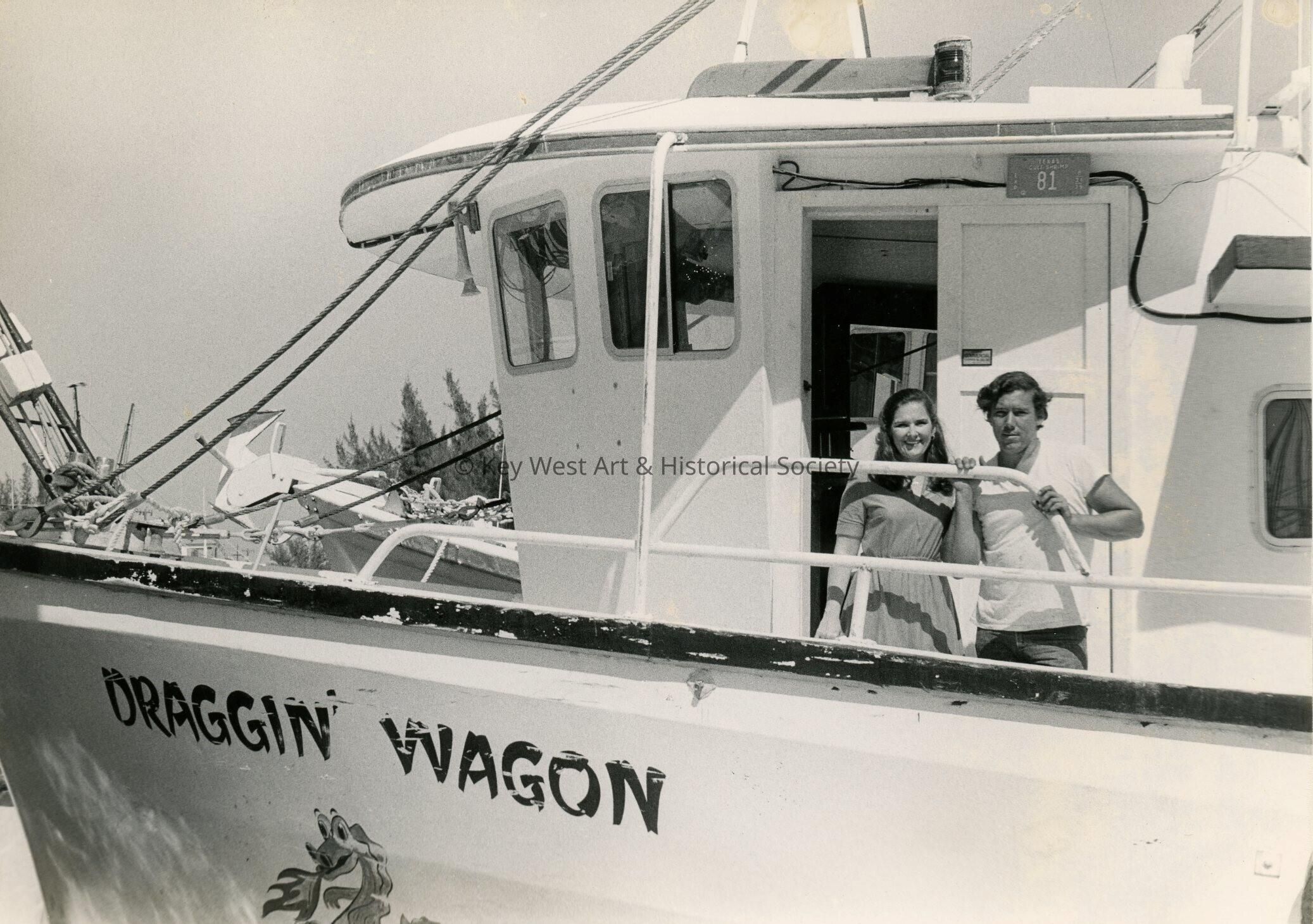 A boat and an unknown man and woman on board