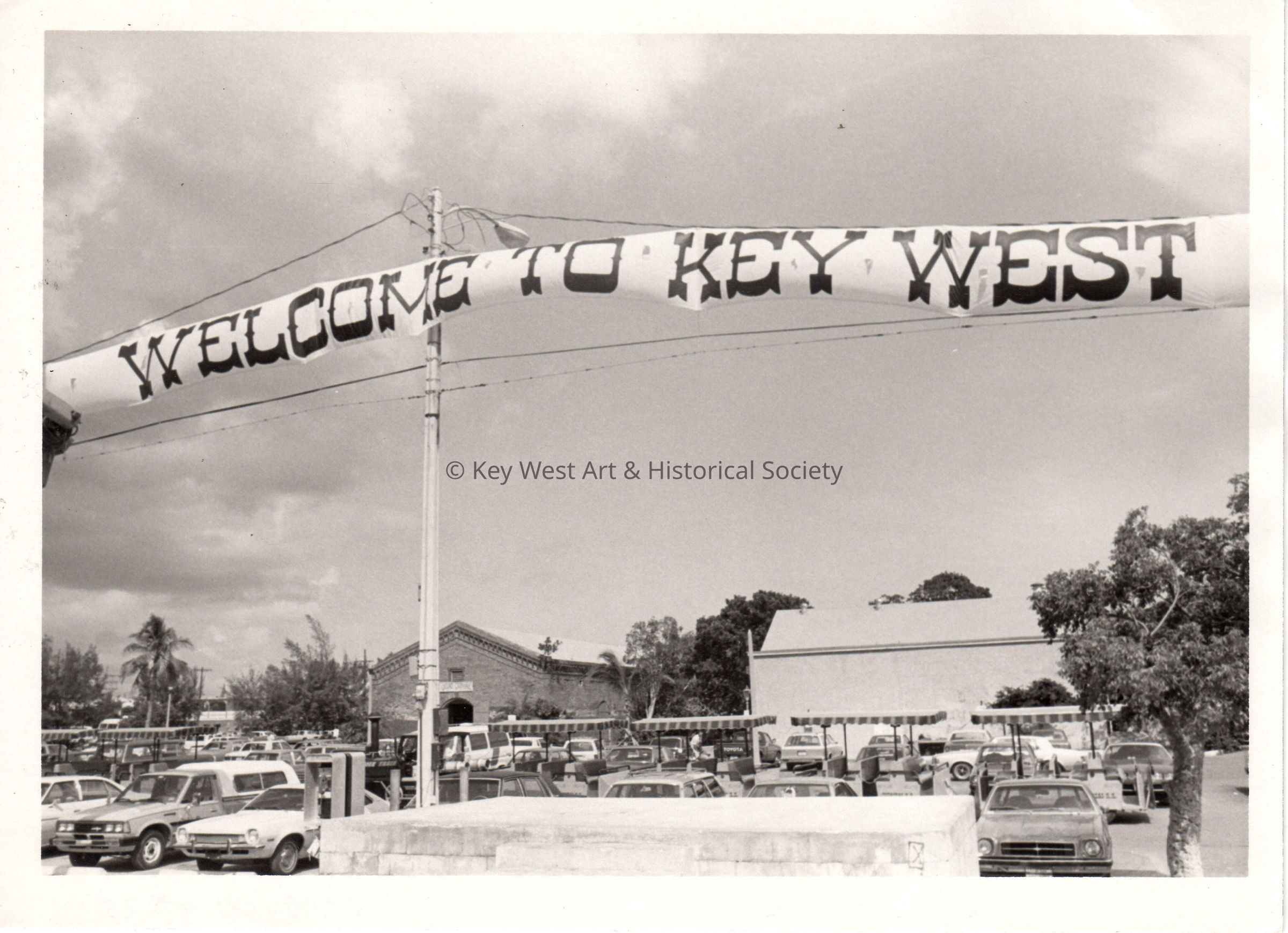 A 'Welcome to Key West' Banner Over Mallory Square; © Key West Art & Historical Society