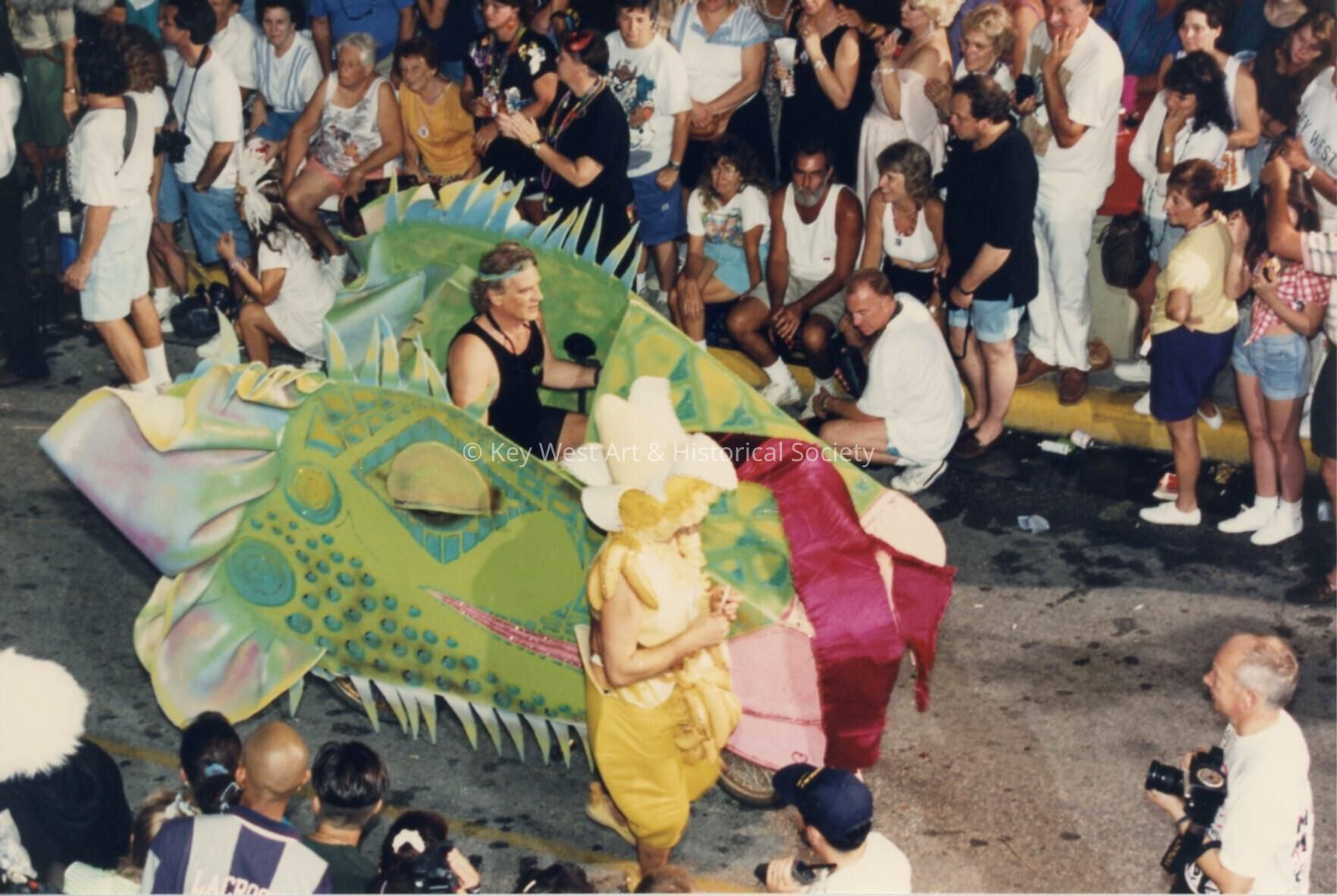 A small float in the parade being driven by a scooter.
