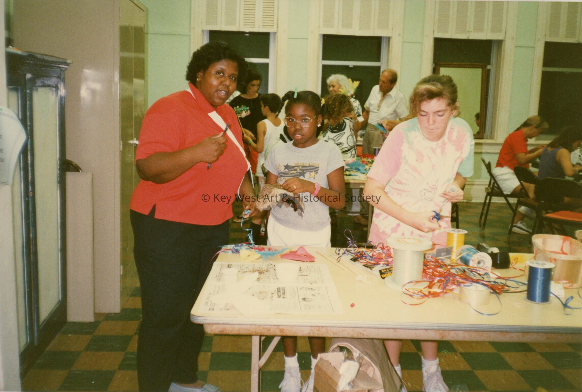A group of unknown people making face masks.