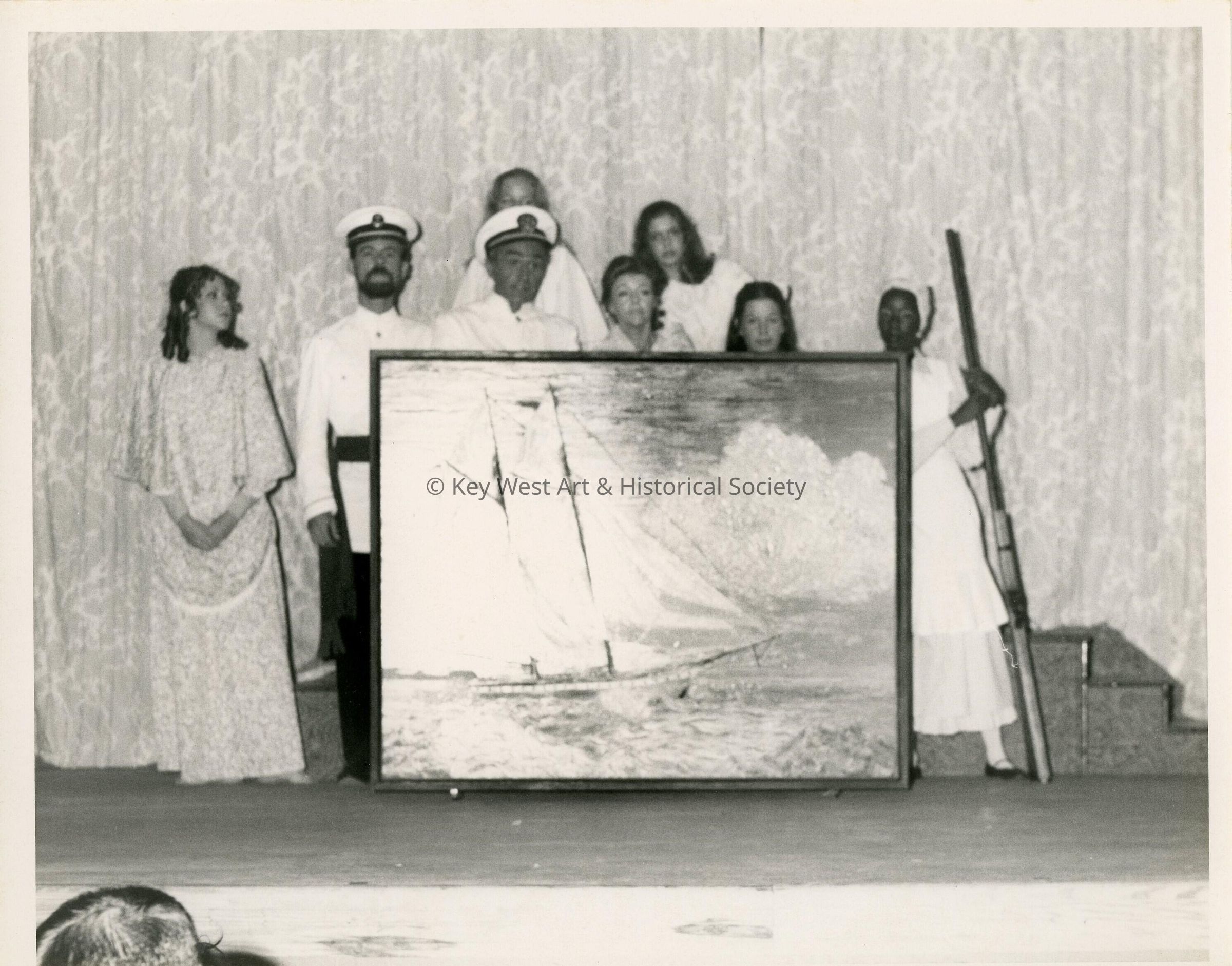 A group of unknown people with artwork