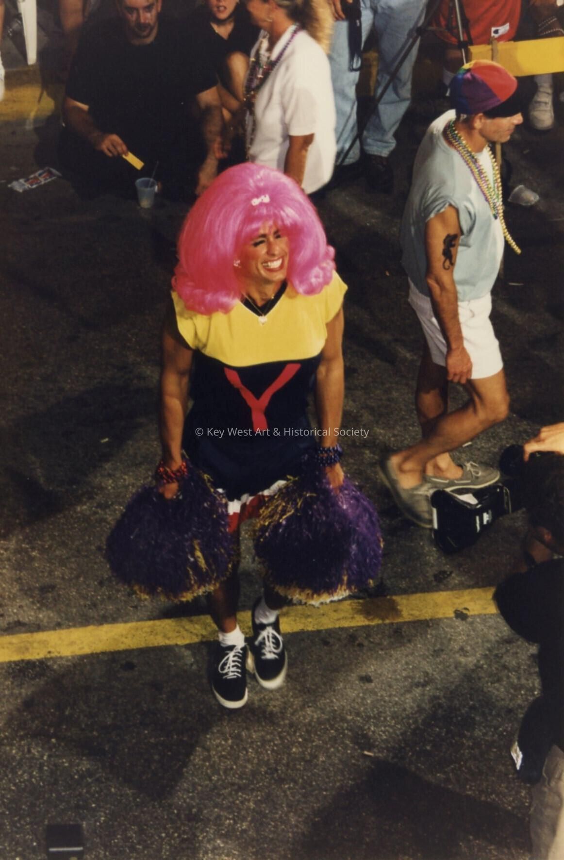 An unknown man dressed up as a cheerleader.