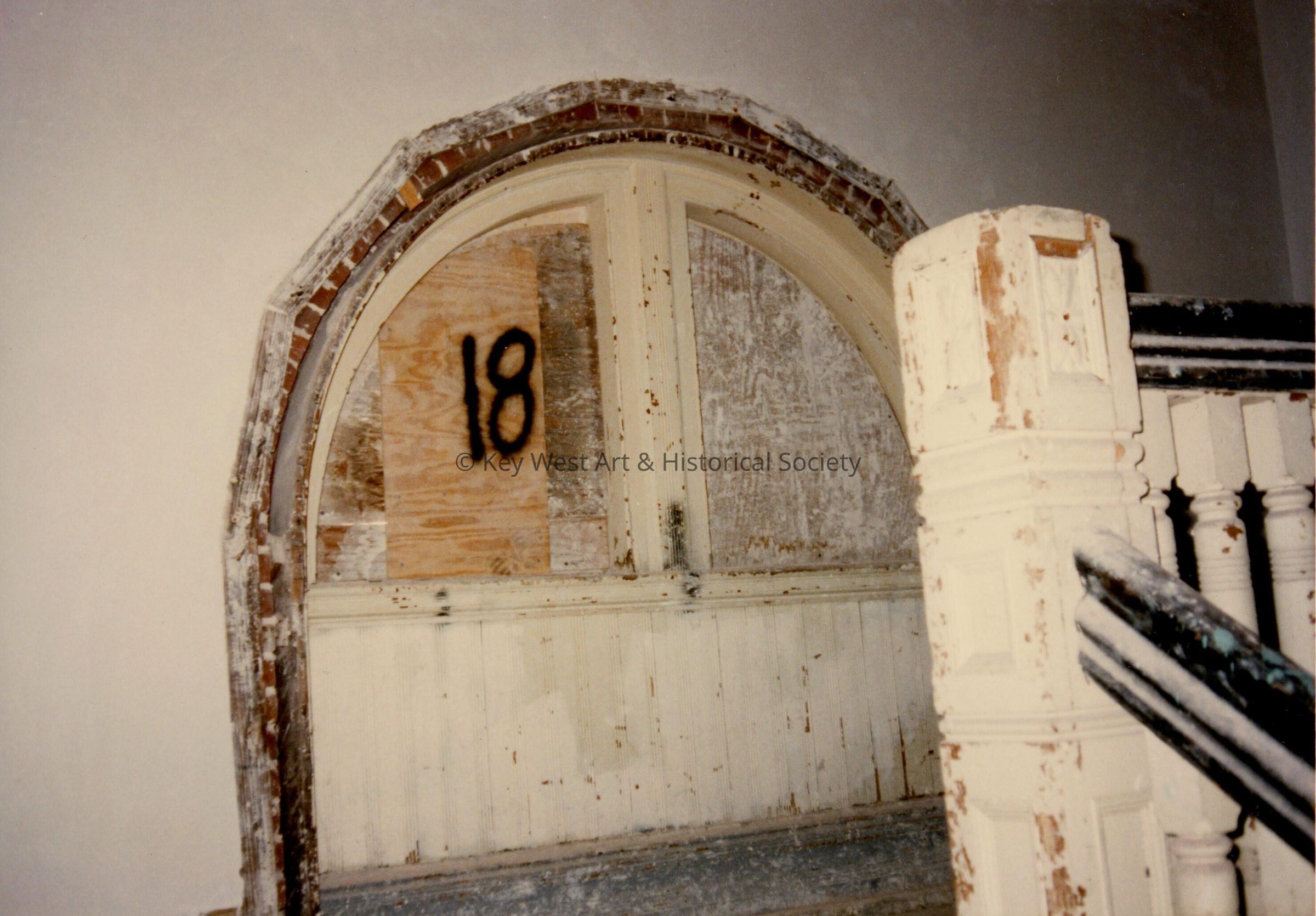 A window near the stairway labeled number 18.