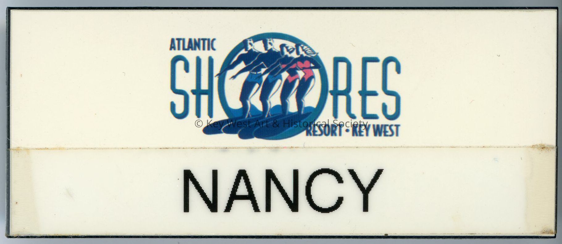 Atlantic Shores Resort staff name tag belonging to Nancy Loewy.; © Key West Art & Historical Society