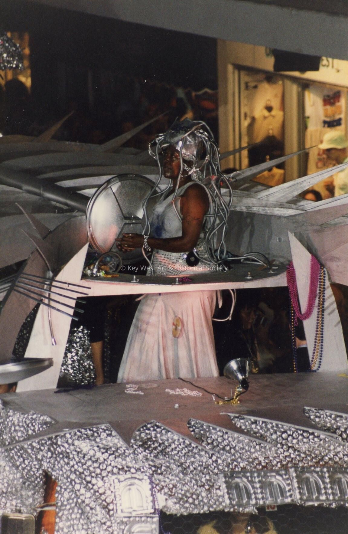 An unknown person dressed up on a float.