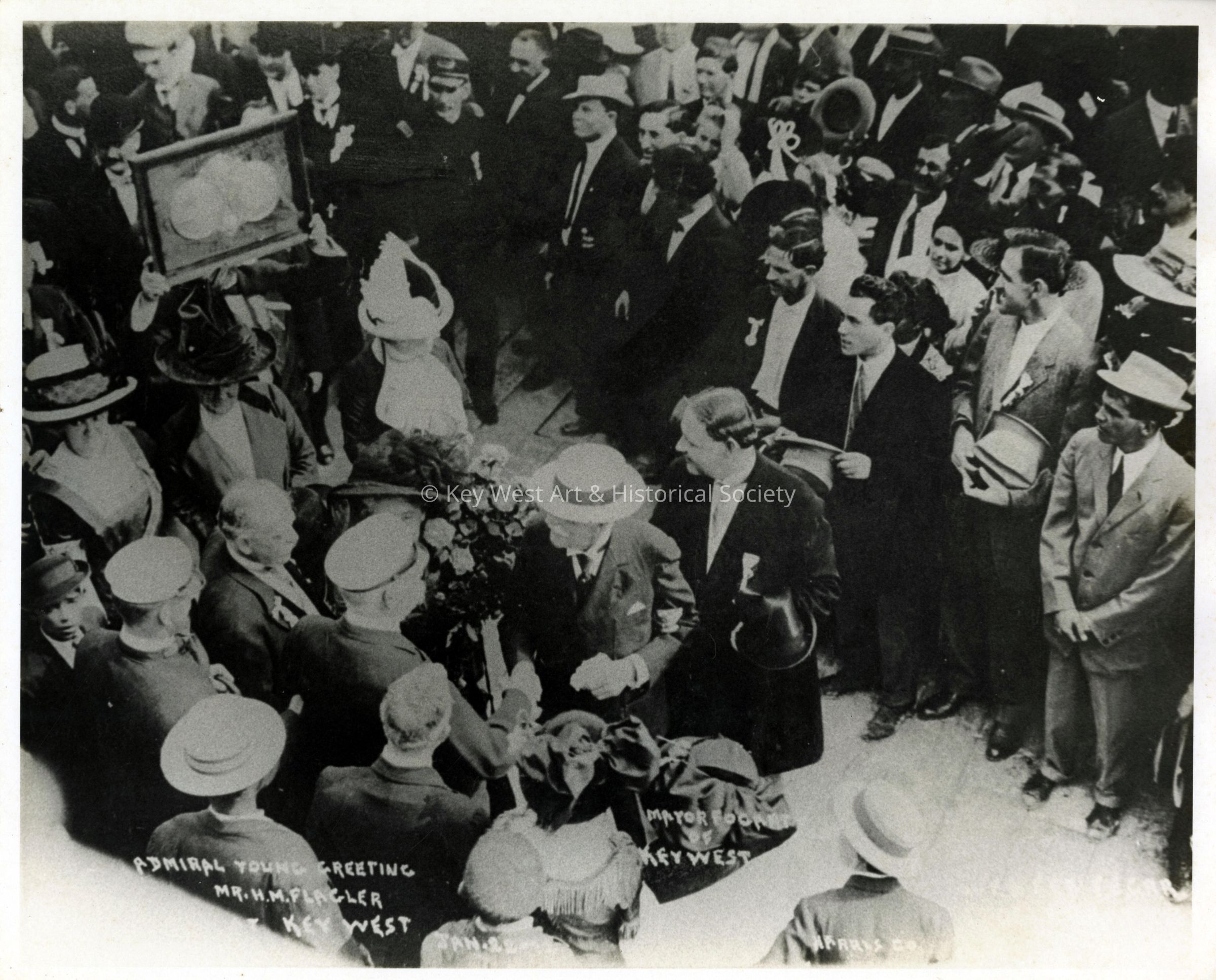 Henry M. Flagler and Rear Admiral Young at the Arrival of the First Train to Key West; © Key West Art & Historical Society