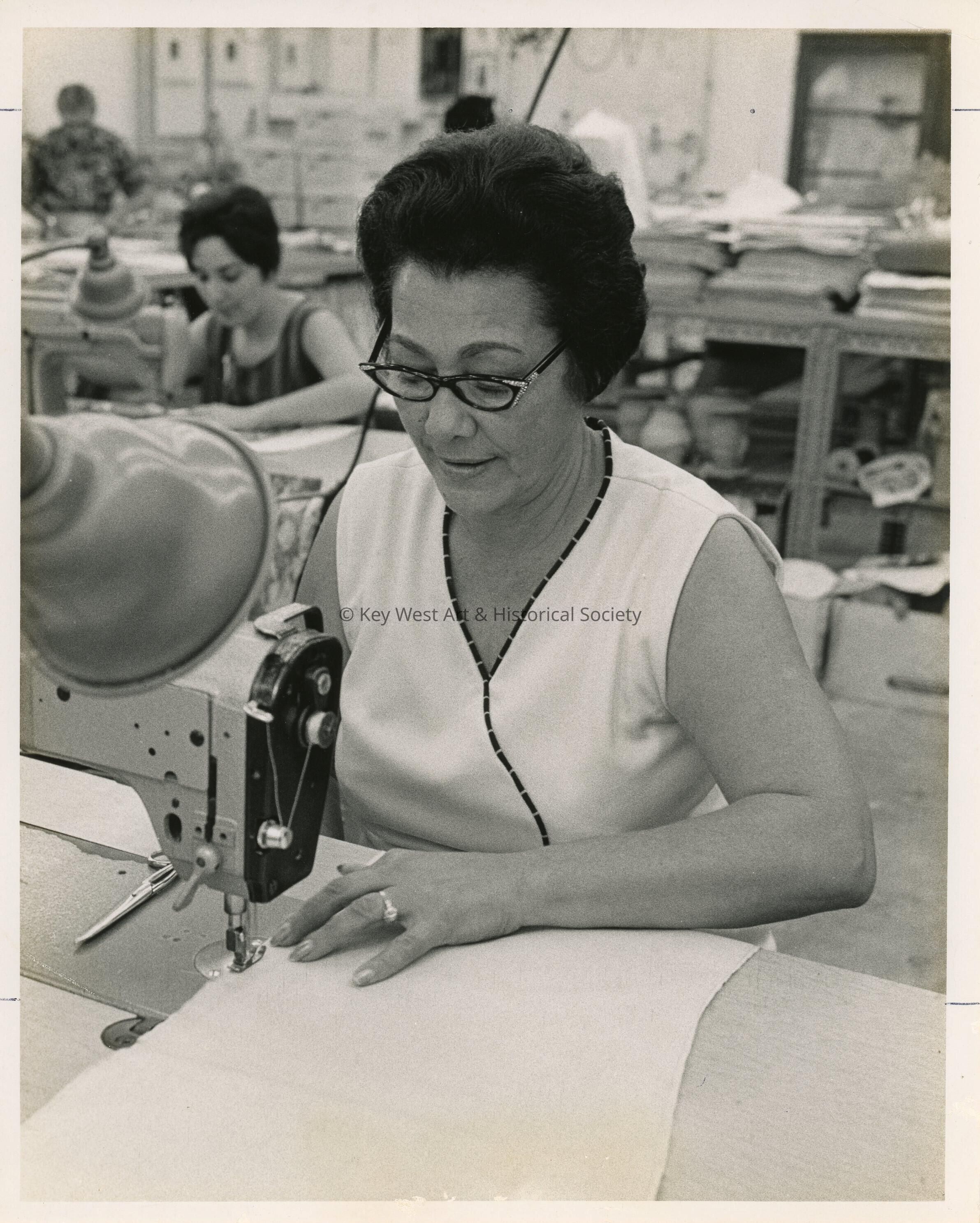 An unknown woman sewing