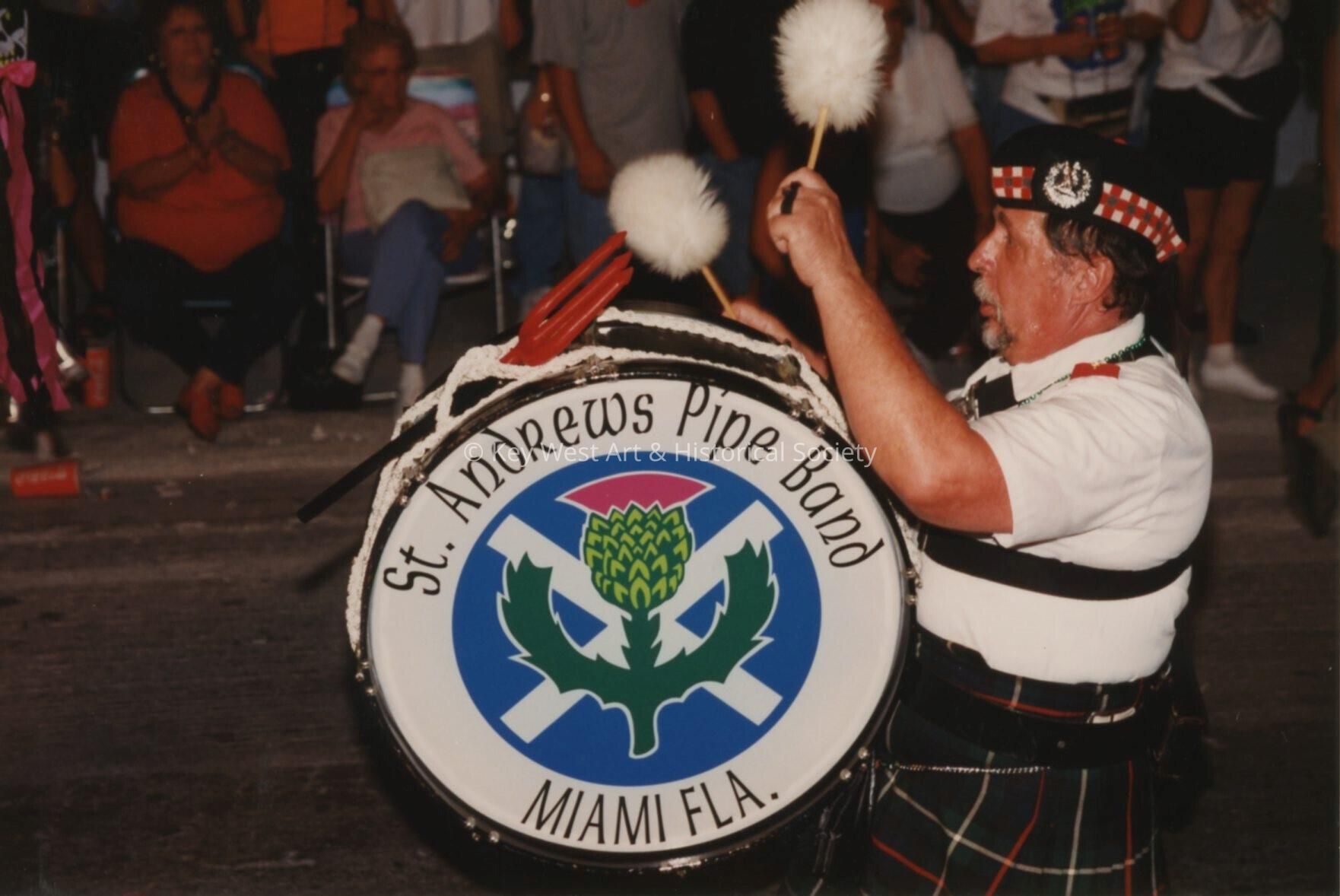 An unknown man in the St. Andrews pipe band from Miami walking in the parad