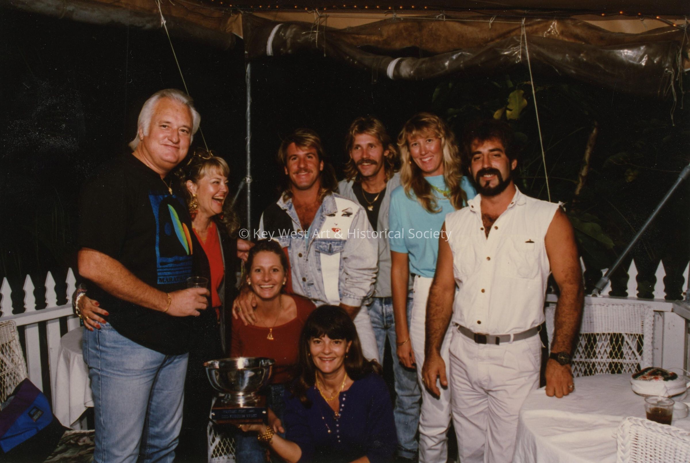 A group of unknown people at a ceremony.