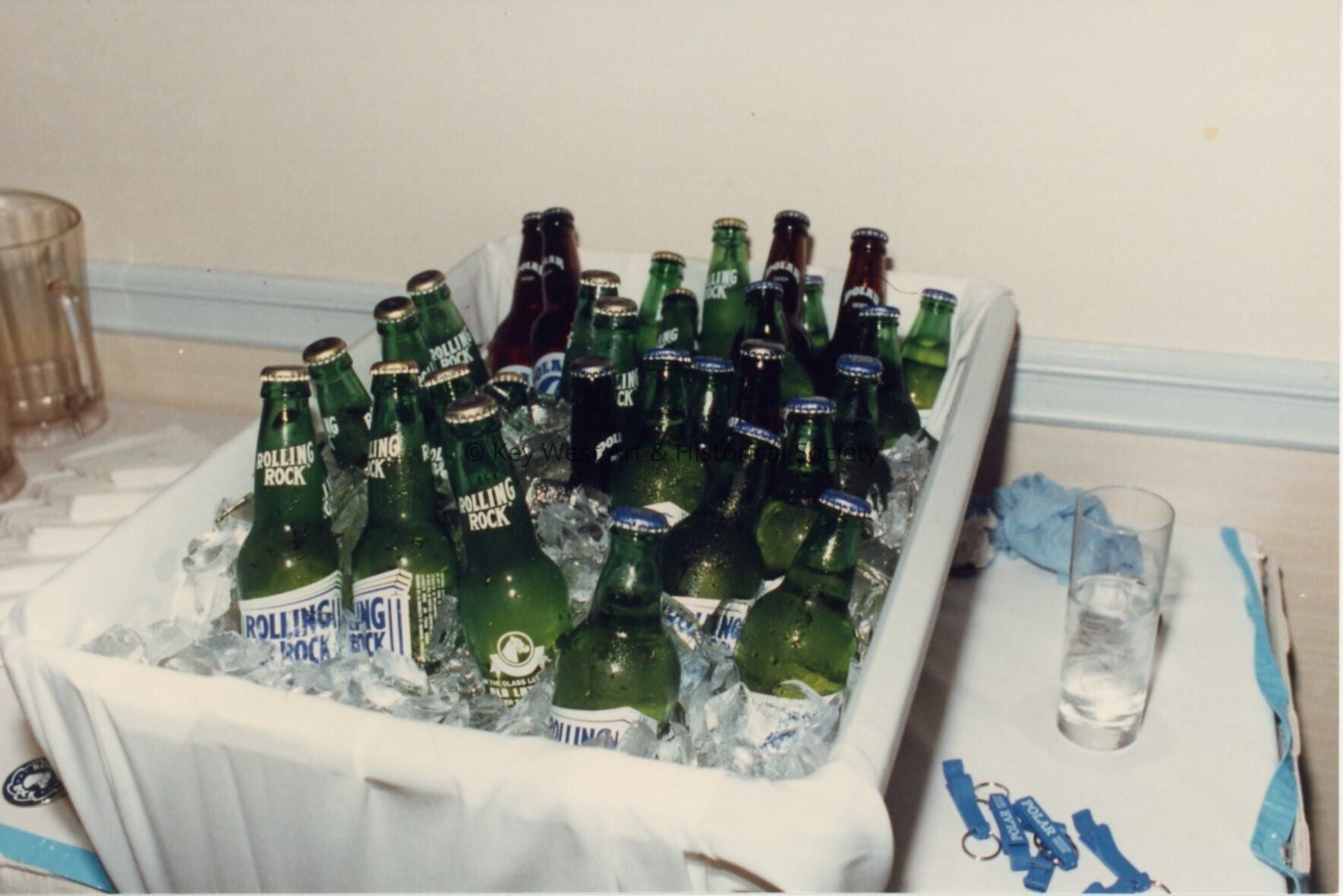 A bin holding rolling rock beer.