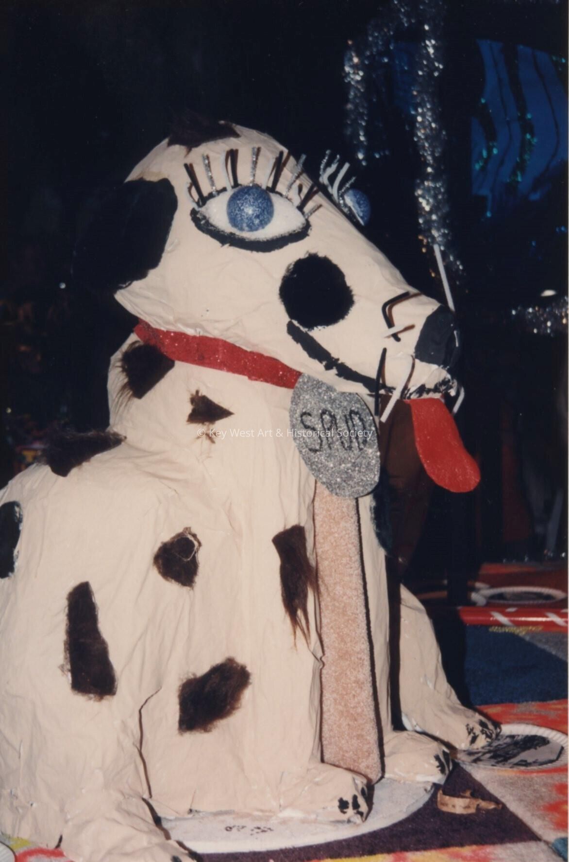 A float that is a dog that reads spud.