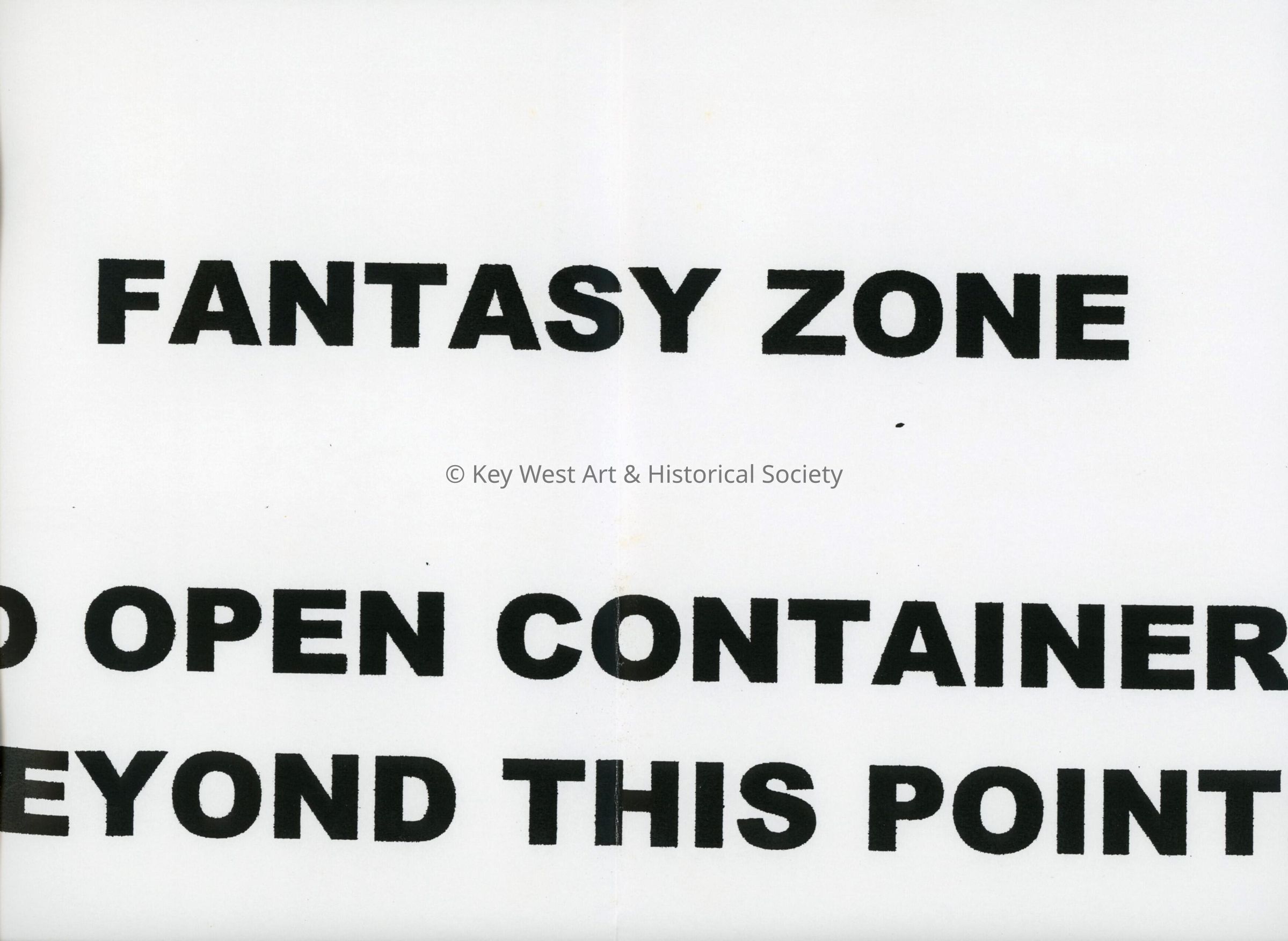 A sign that reads Fantasy zone. No open containers beyond this point.