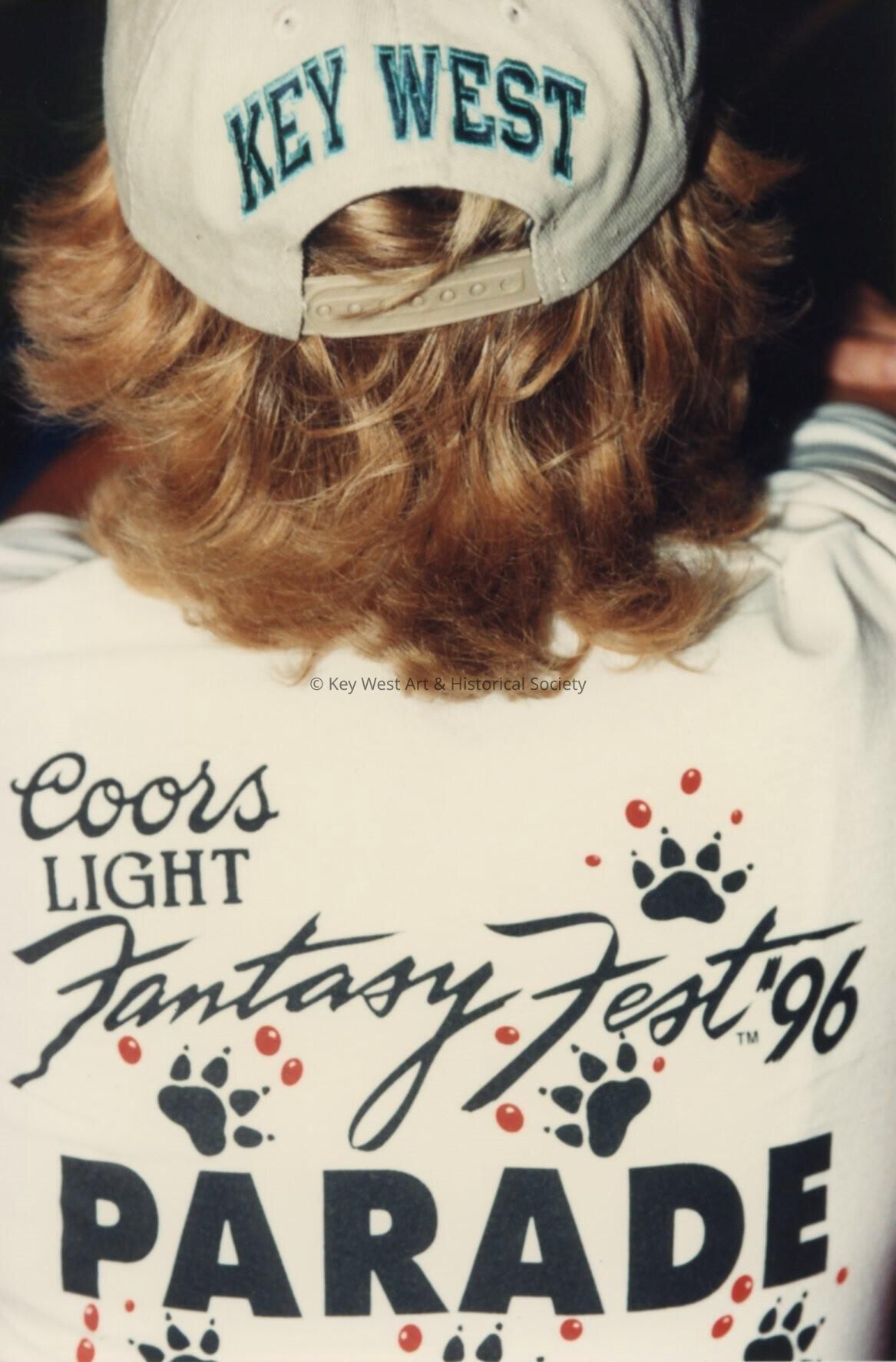 An unknown man wearing a Coors light Fantasy Fest Parade shirt and Key West