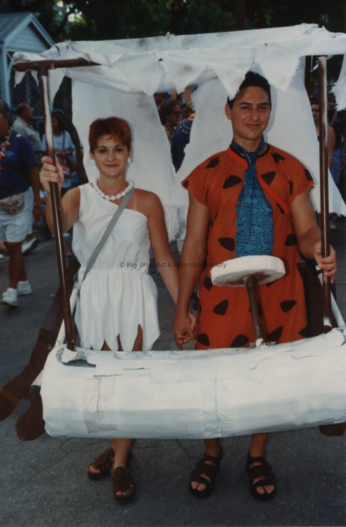 An unknown couple dressed up like Fred and Wilma Flintstone.