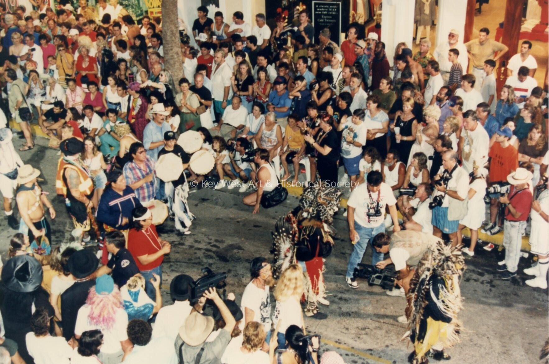 A group of people in the street during the parade.