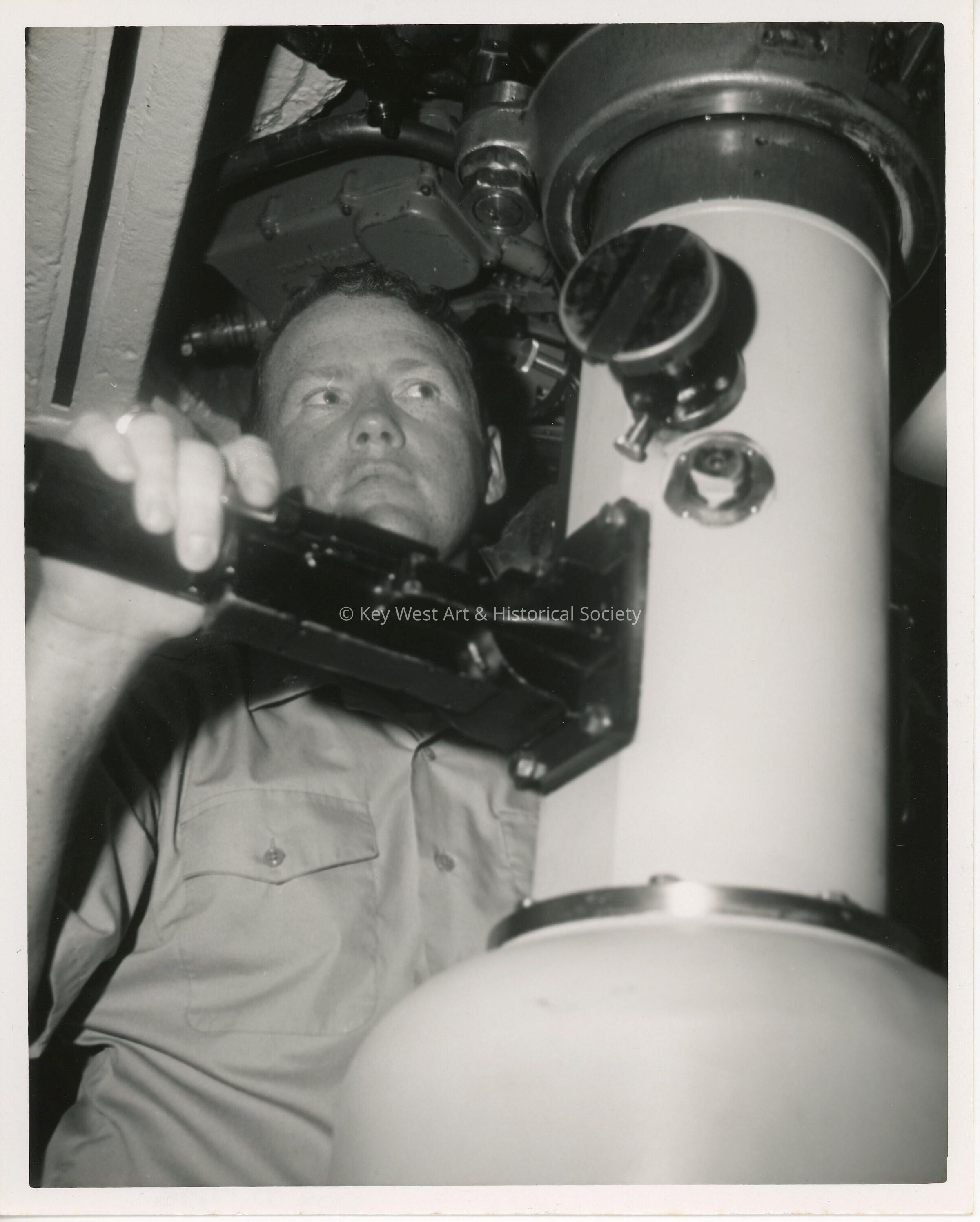 An unknown man in uniform on a ship