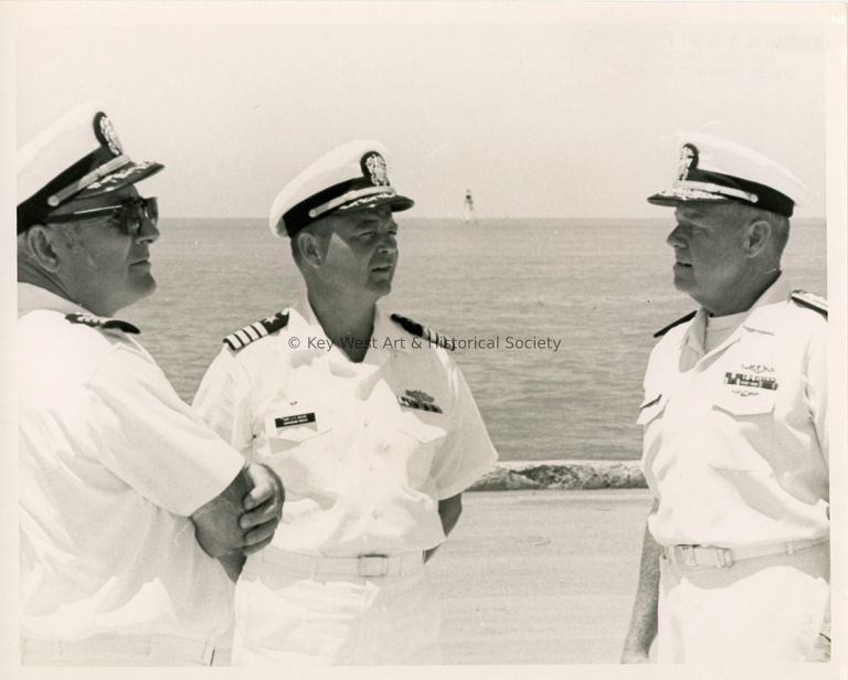 3 Men in uniform talking outside