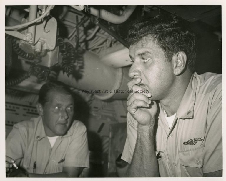 2 Men in uniform in a control room