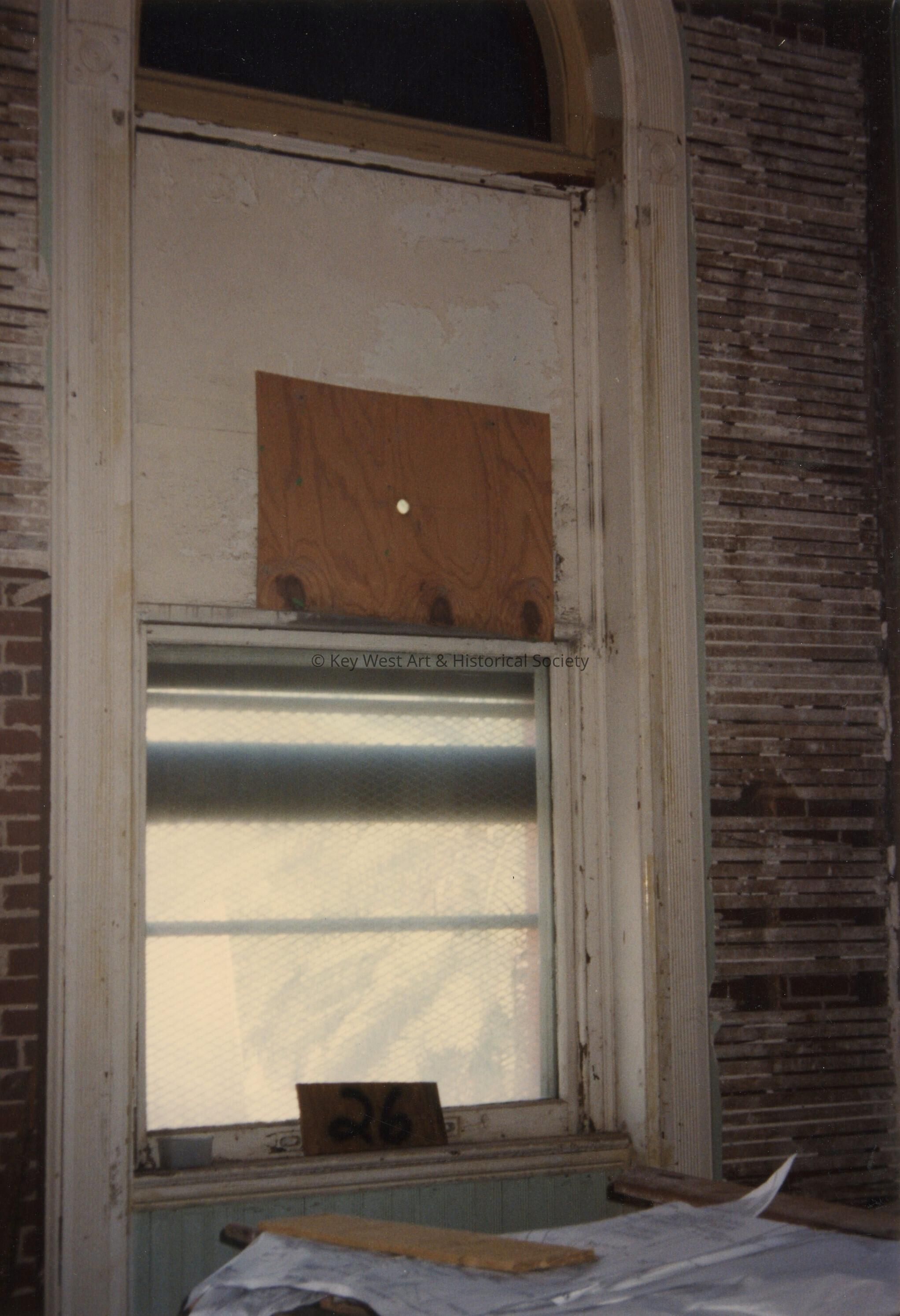 A window labeled number 26.