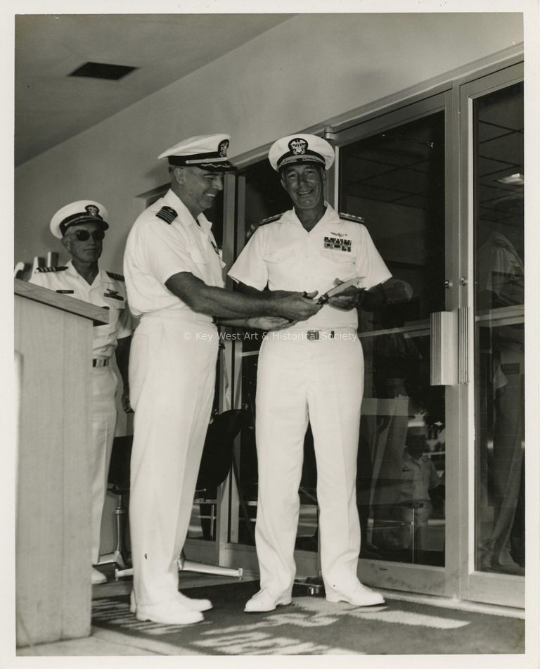 3 Men in uniform at a ceremony