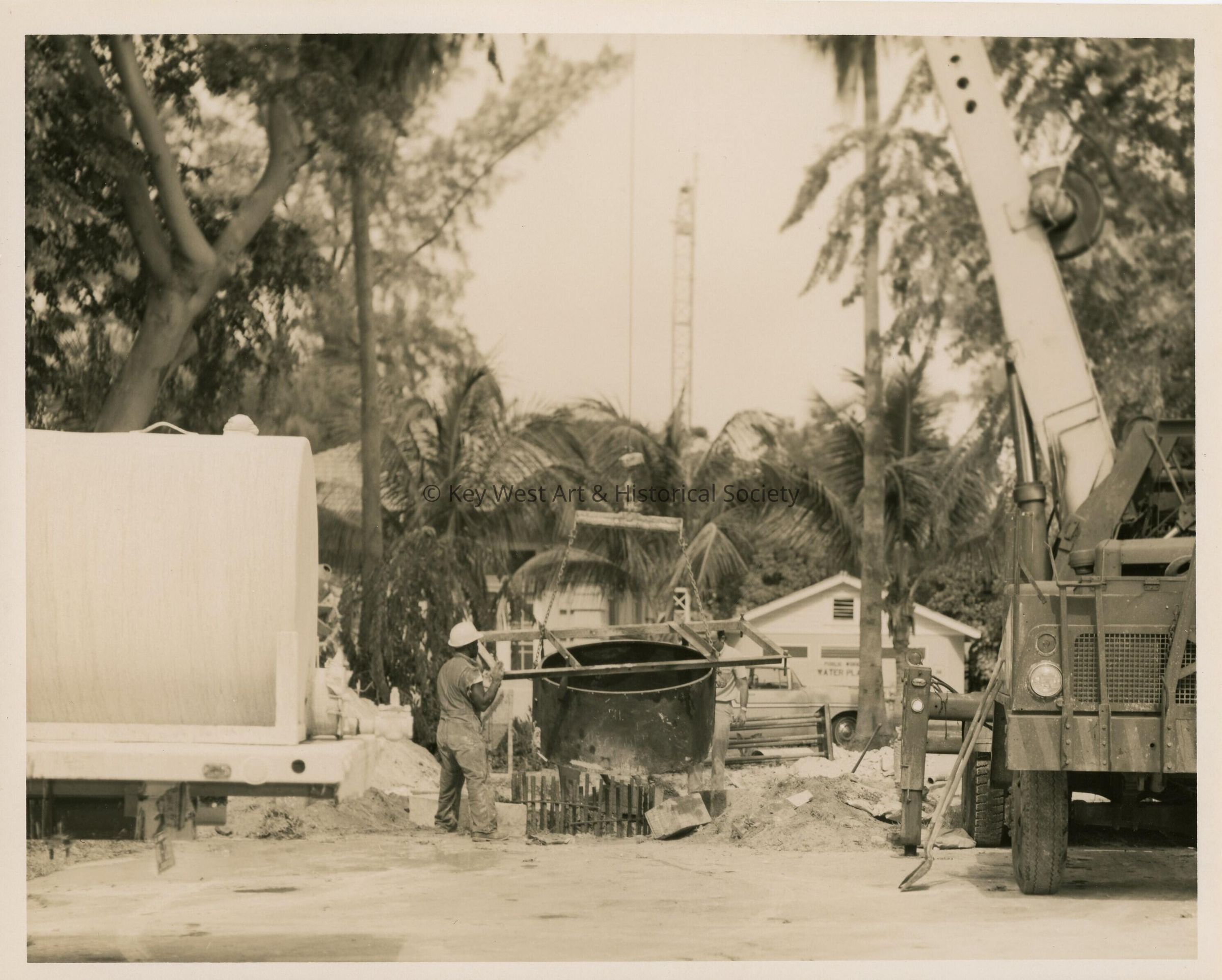 An unknown guy working on something outside