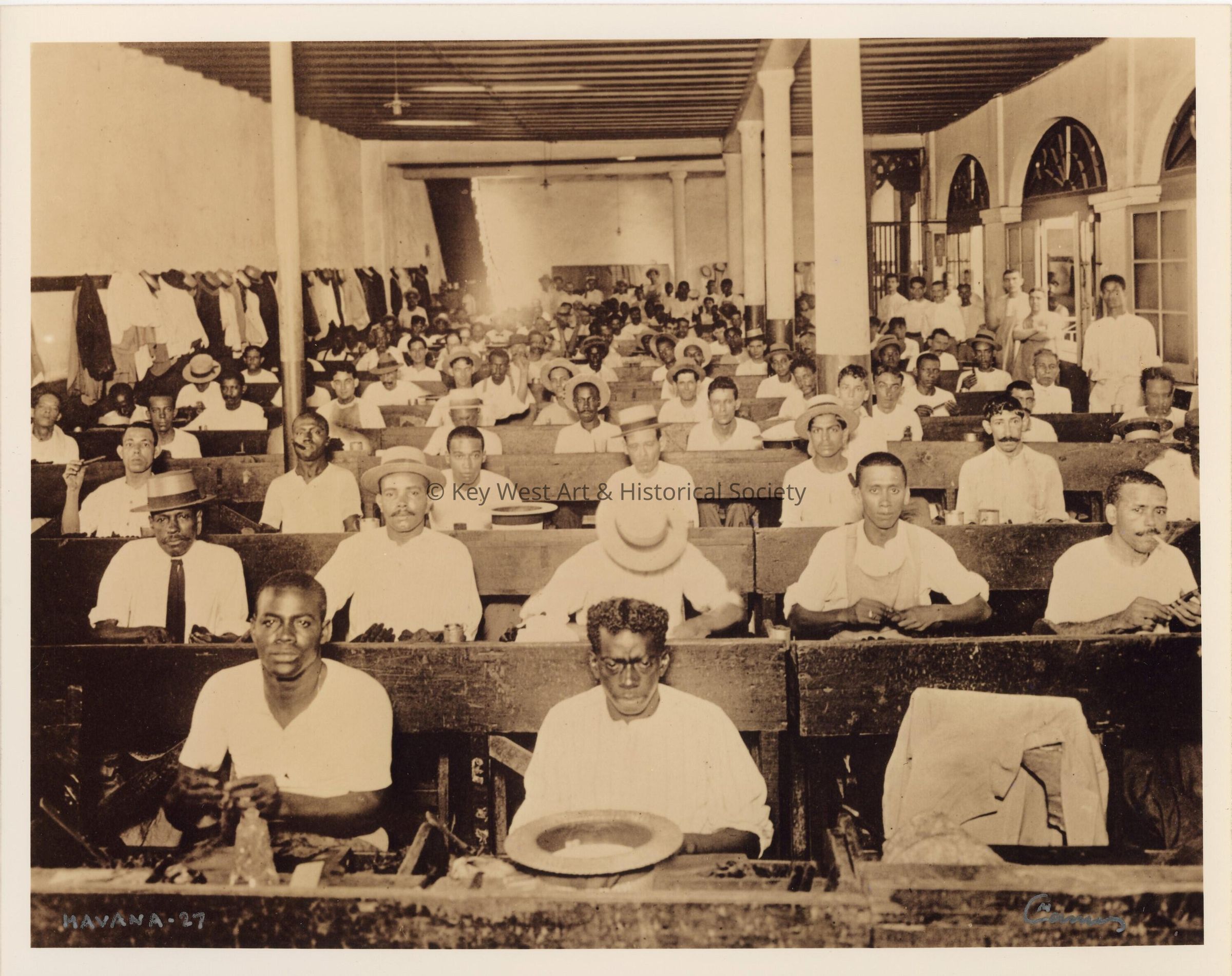 A group of people working in a tobacco factory in Cuba