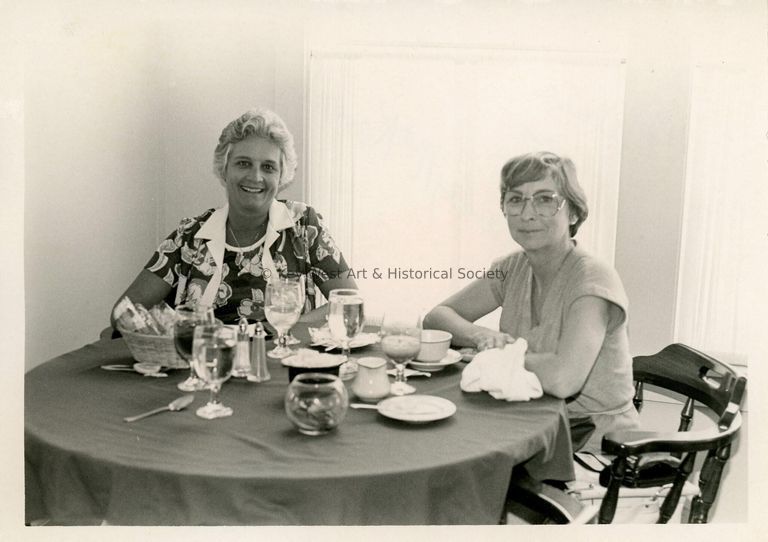 2 Unknown woman at a table