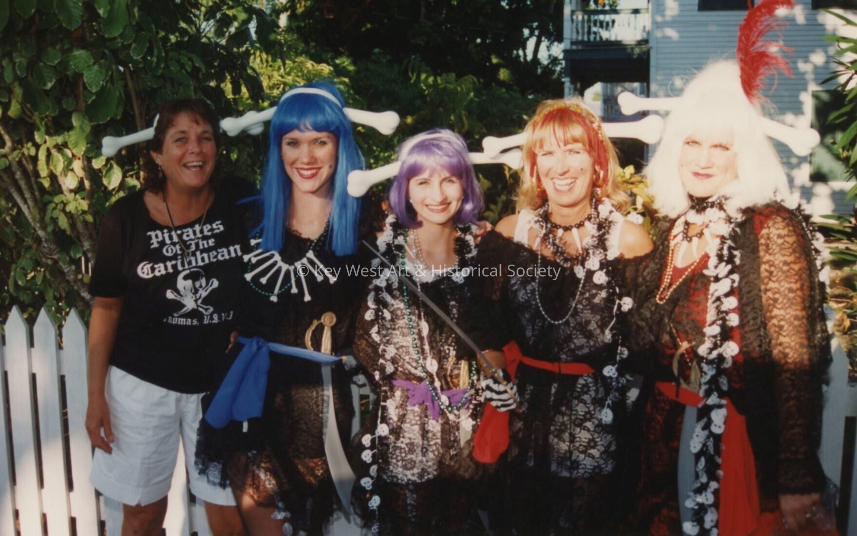 Five unknown woman dressed up.