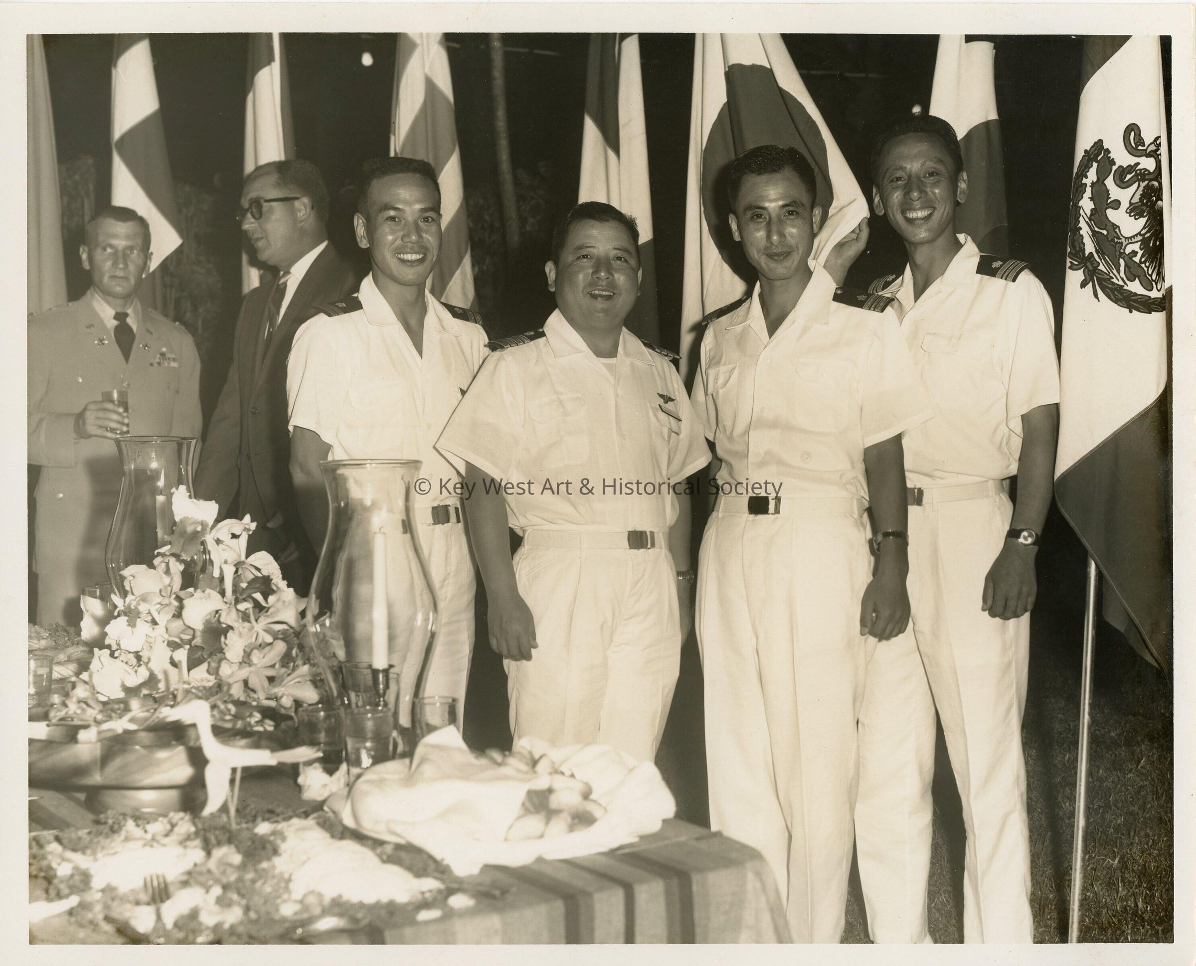 Men in uniform at a party