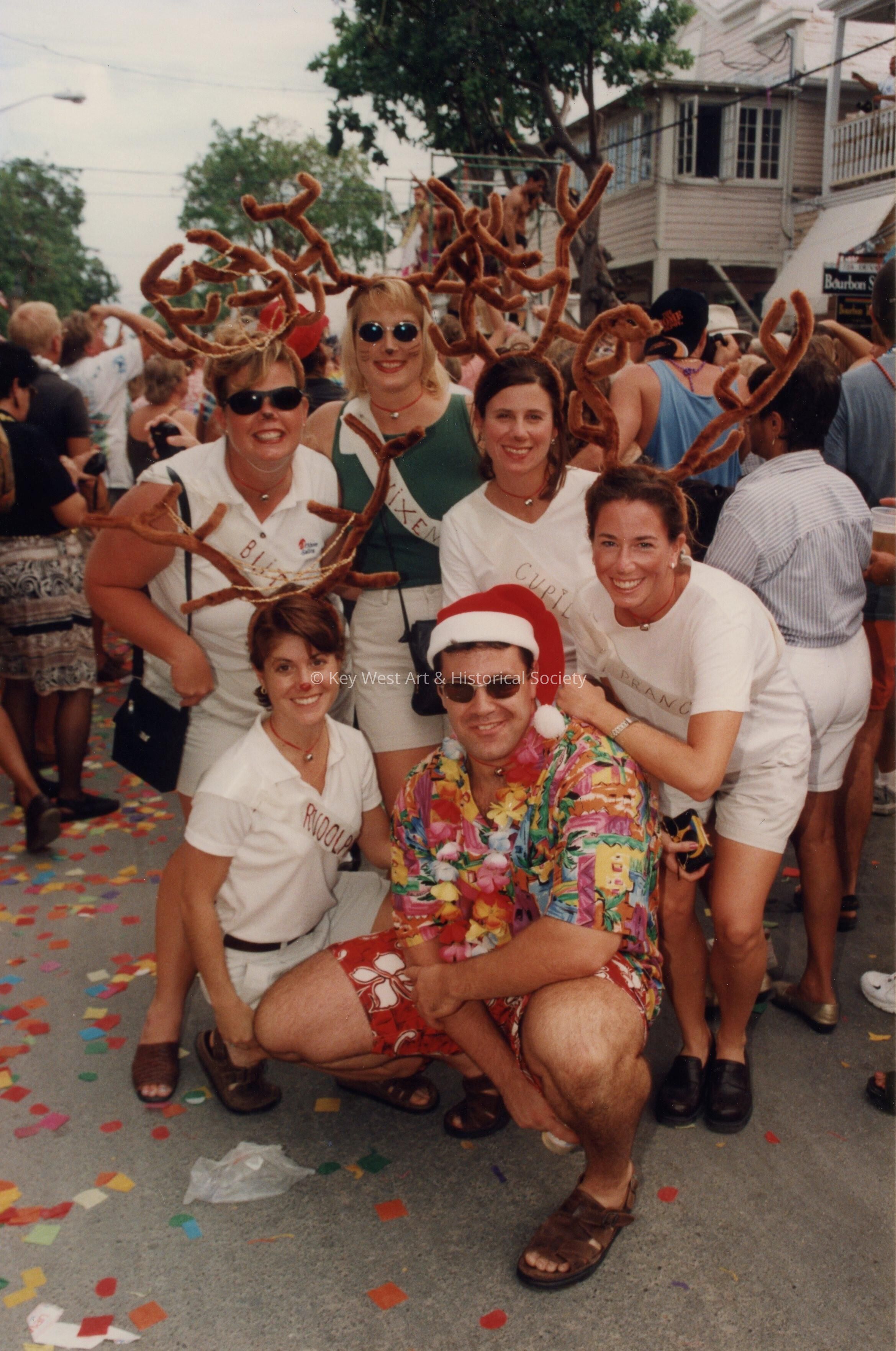 A group of unknown people dressed up.